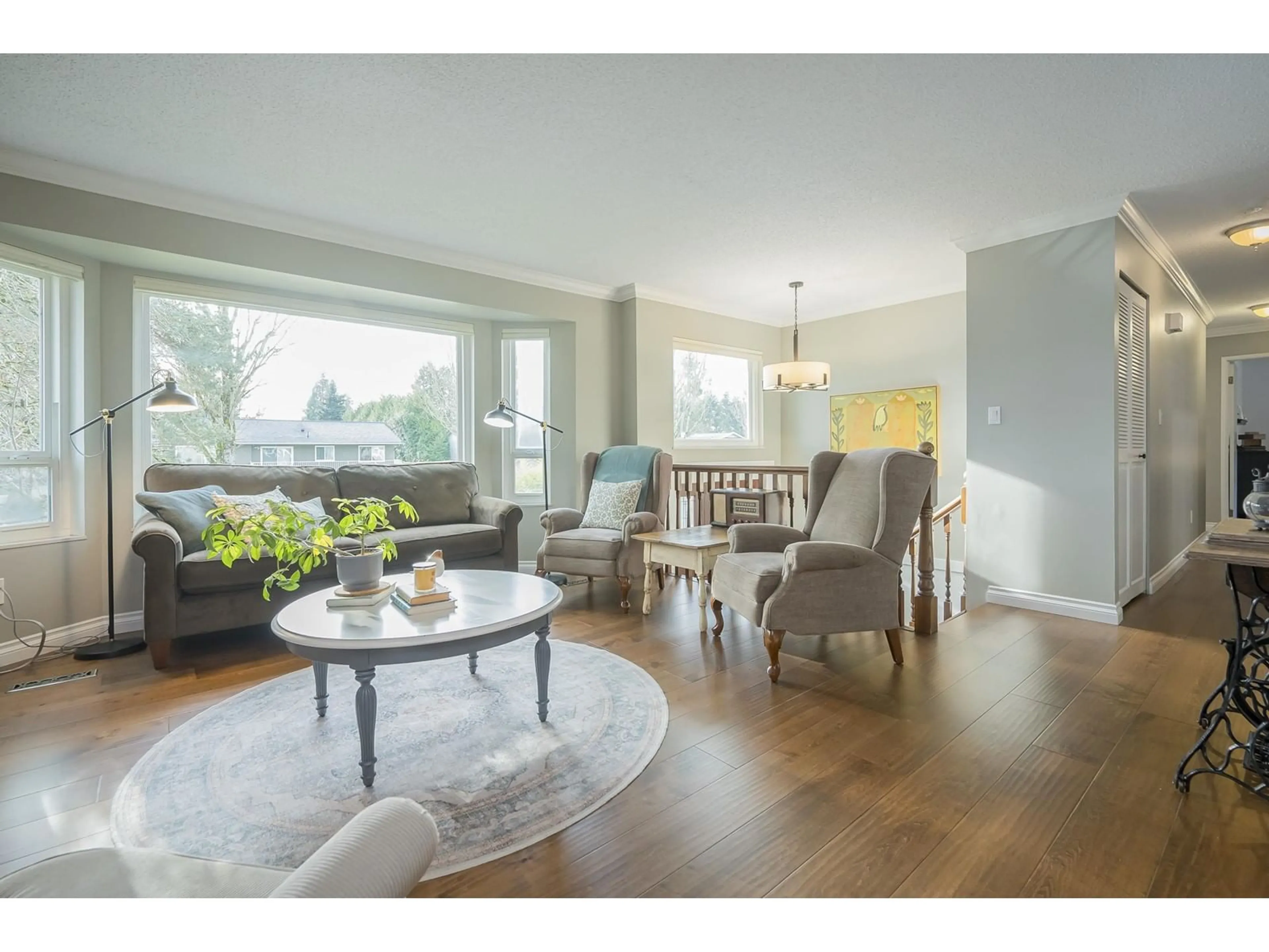 Living room with furniture, wood/laminate floor for 18253 58B AVENUE, Surrey British Columbia V3S5V9