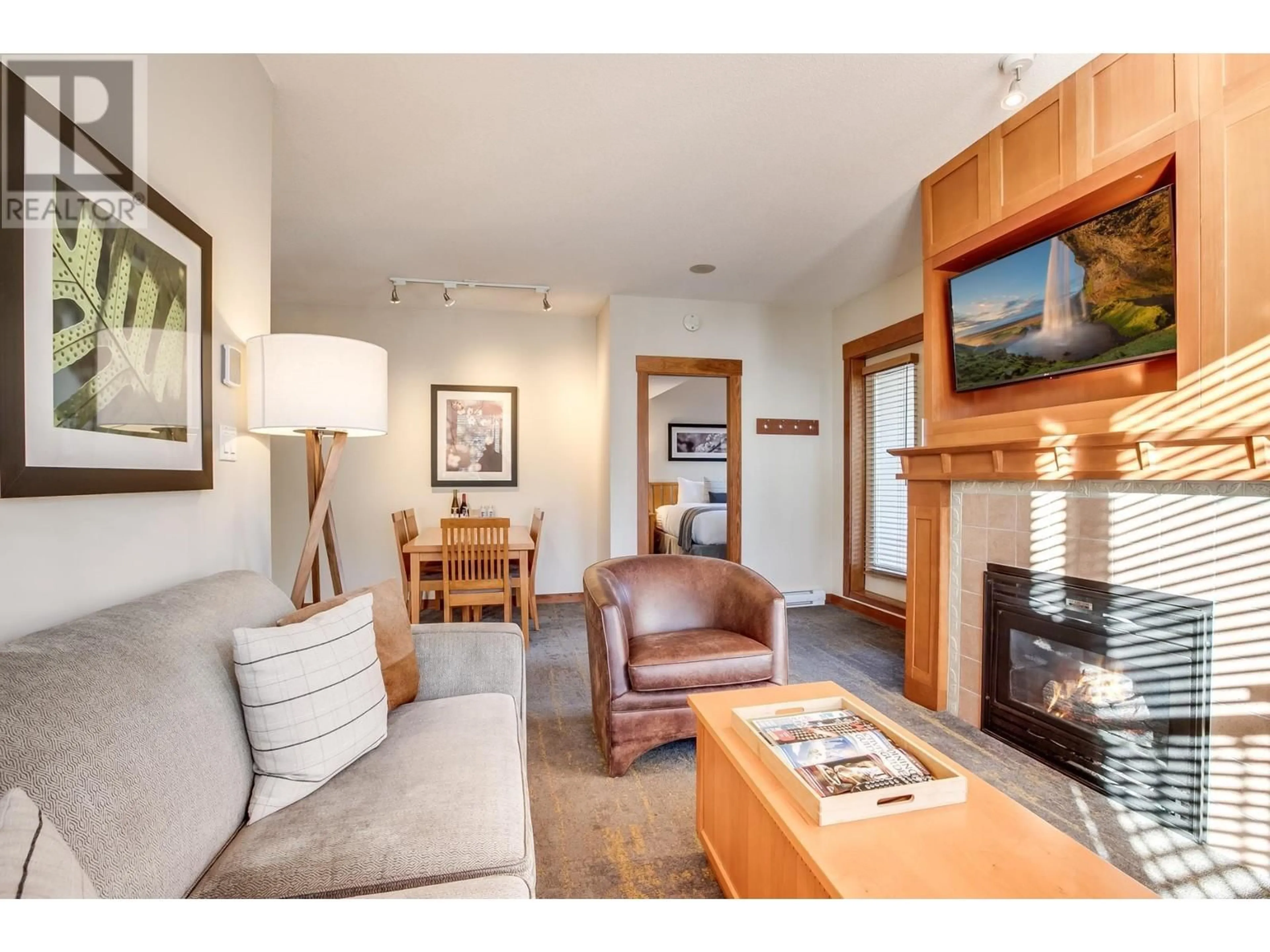 Living room with furniture, wood/laminate floor for 516 4320 SUNDIAL CRESCENT, Whistler British Columbia V8E1G6