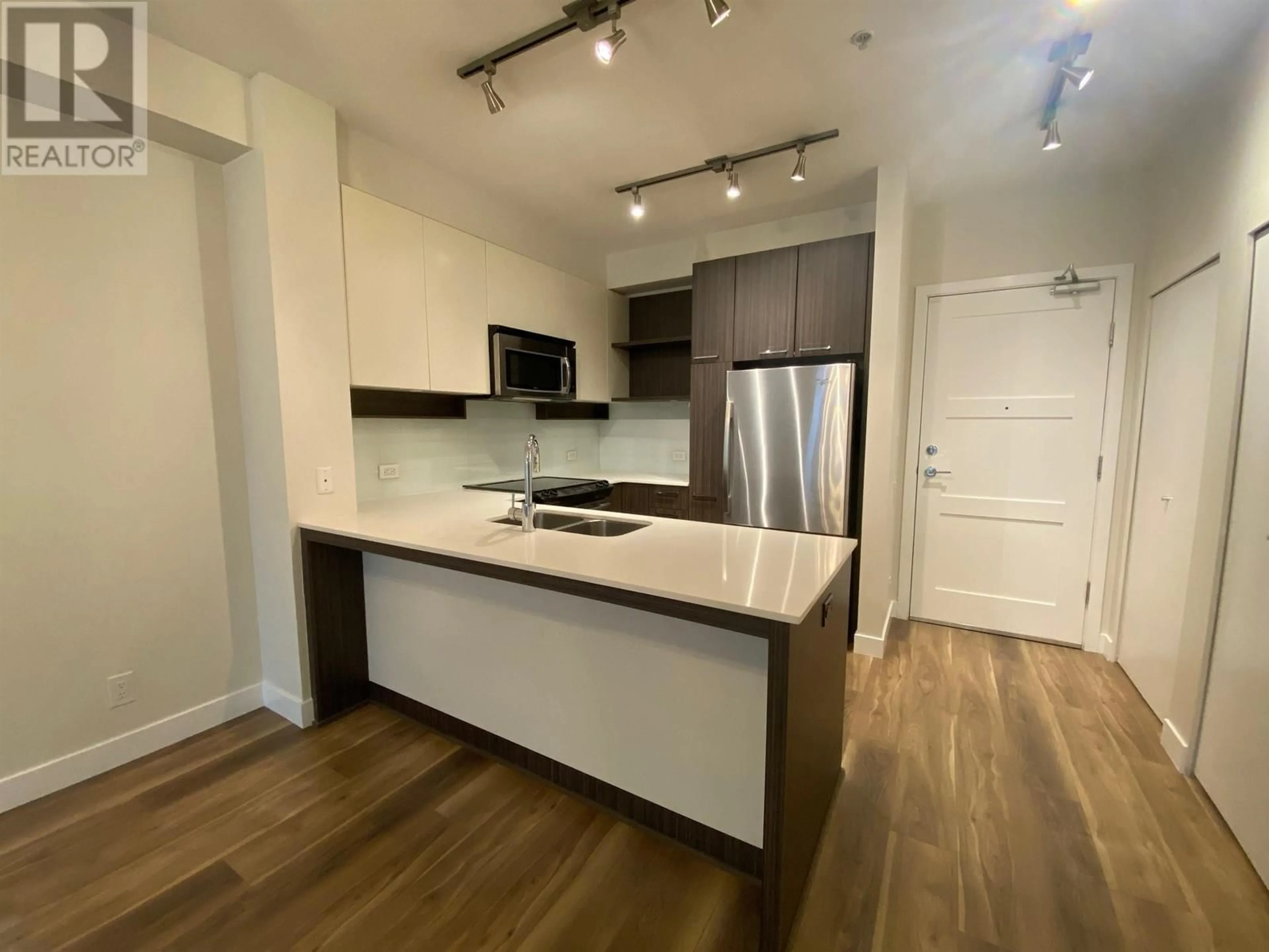 Open concept kitchen, wood/laminate floor for 110 545 FOSTER AVENUE, Coquitlam British Columbia V3J0B3