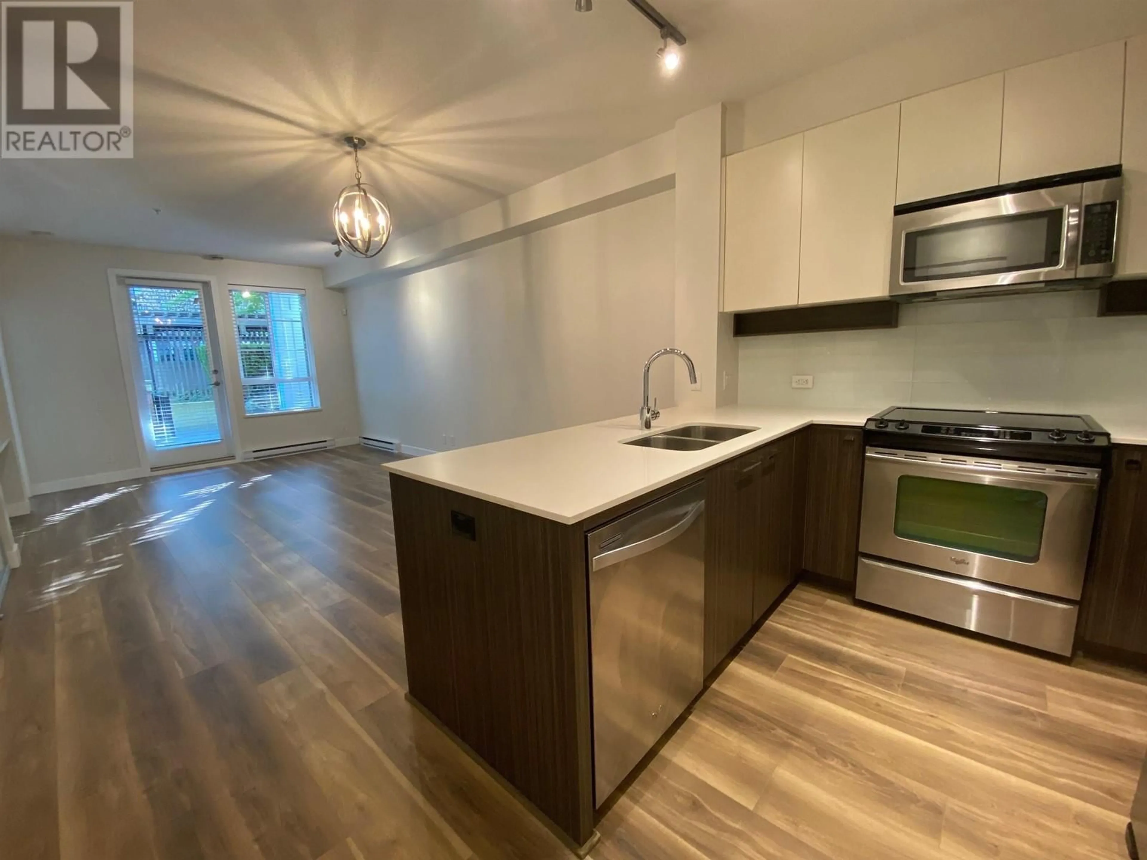 Open concept kitchen, wood/laminate floor for 110 545 FOSTER AVENUE, Coquitlam British Columbia V3J0B3