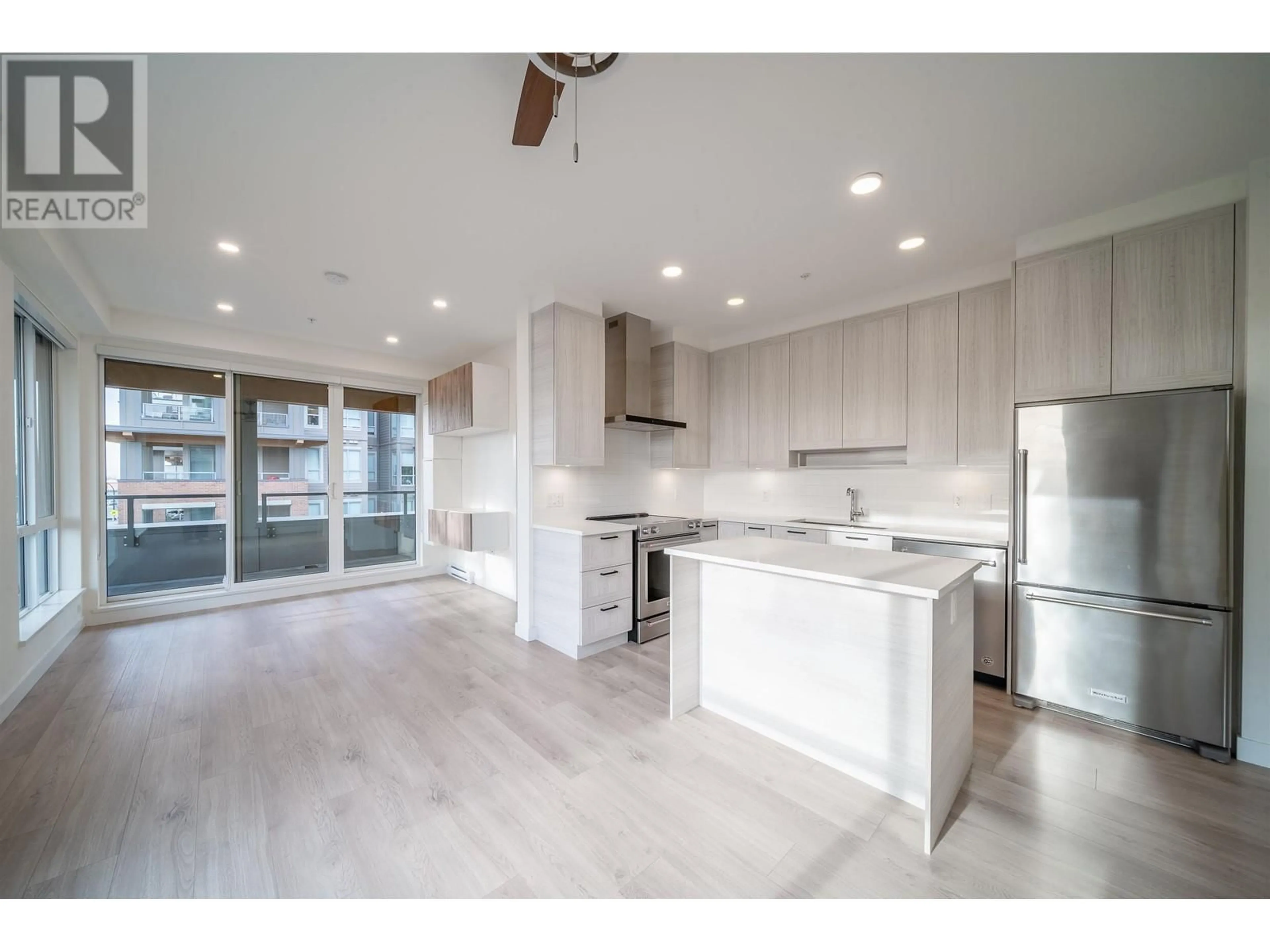 Open concept kitchen, wood/laminate floor for 411 7169 14TH AVENUE, Burnaby British Columbia V3N0H6