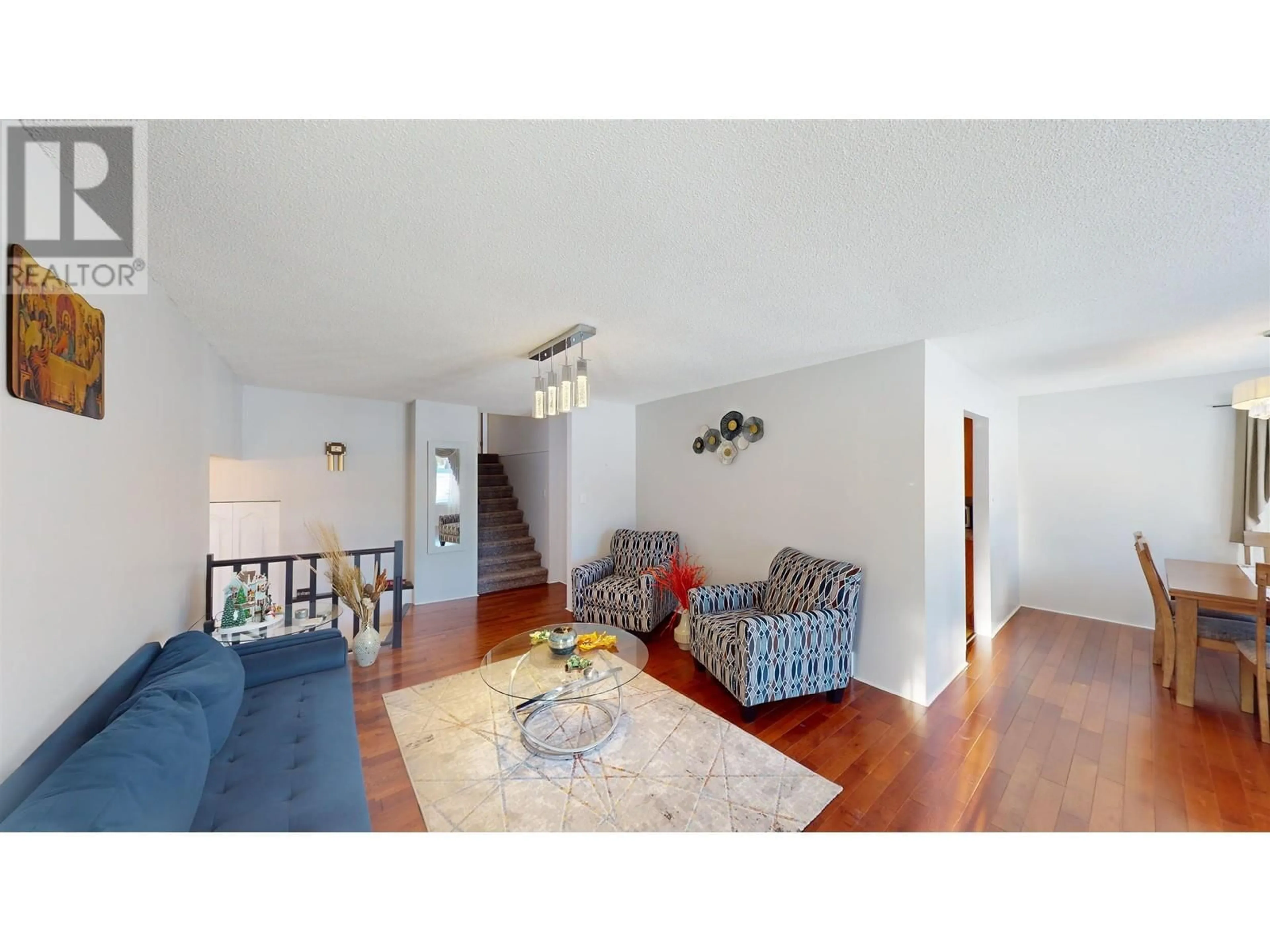 Living room with furniture, wood/laminate floor for 157 THOMPSON ROAD, Quesnel British Columbia V2J5B5