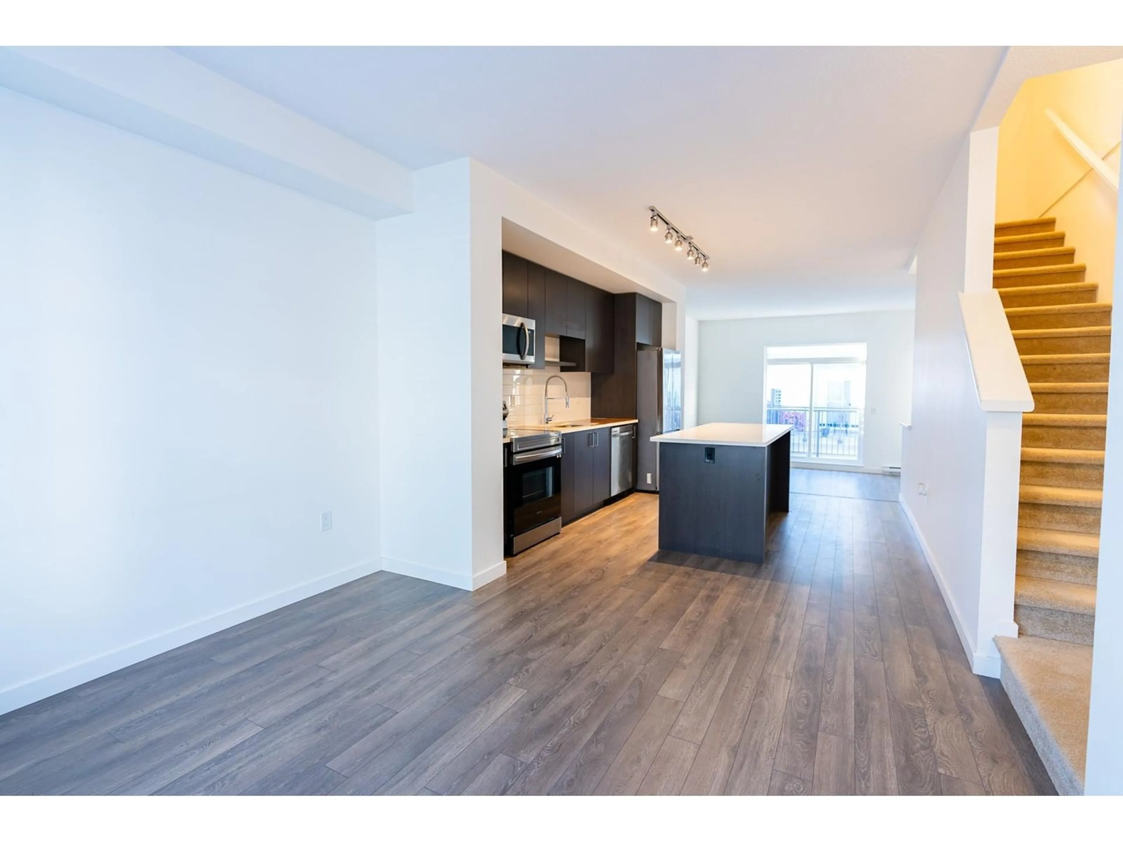 Open concept kitchen, wood/laminate floor for 95 15778 85 AVENUE, Surrey British Columbia V4N6W8