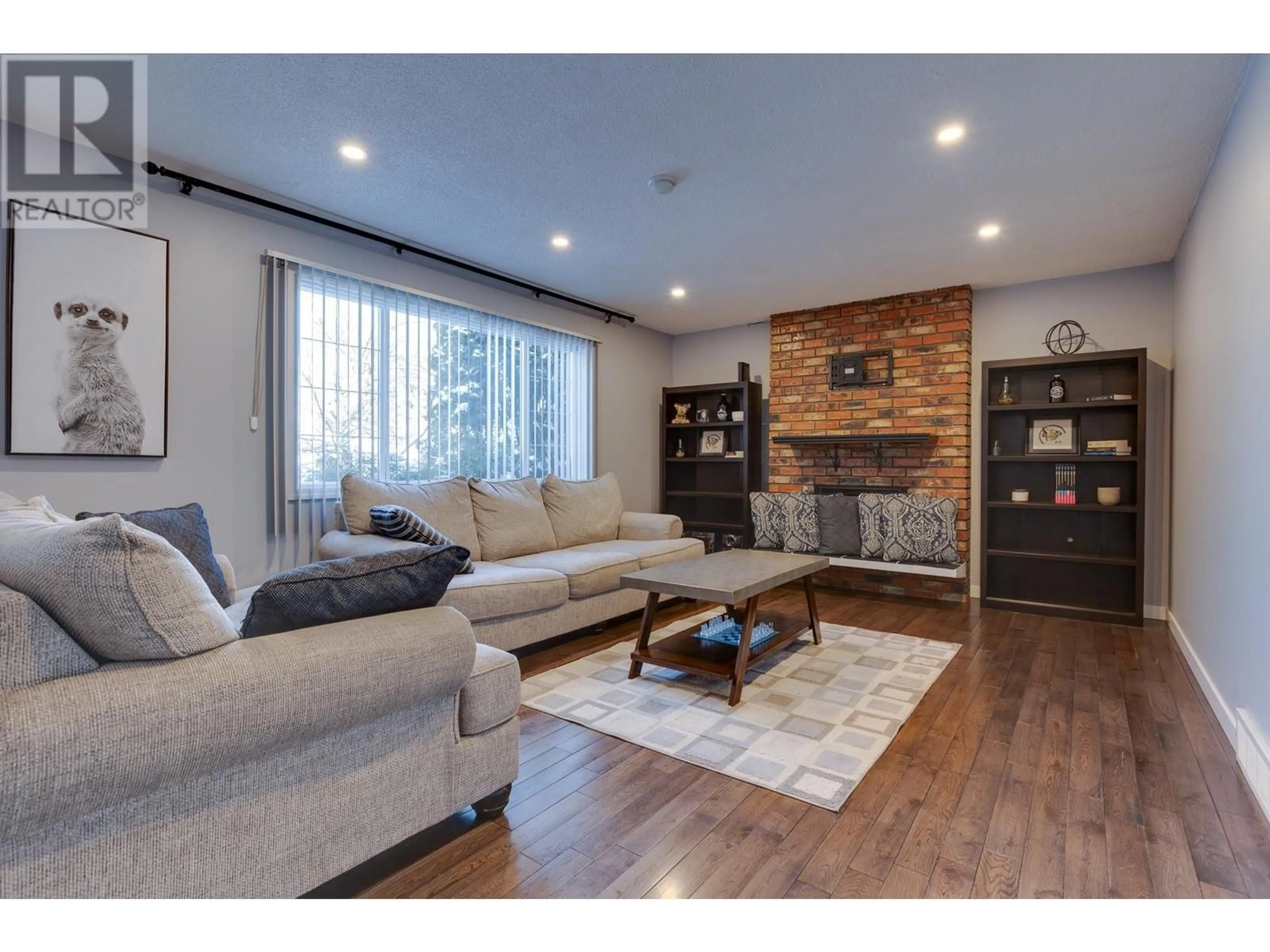 Living room with furniture, wood/laminate floor for 7646 MCMASTER CRESCENT, Prince George British Columbia V2N3L2