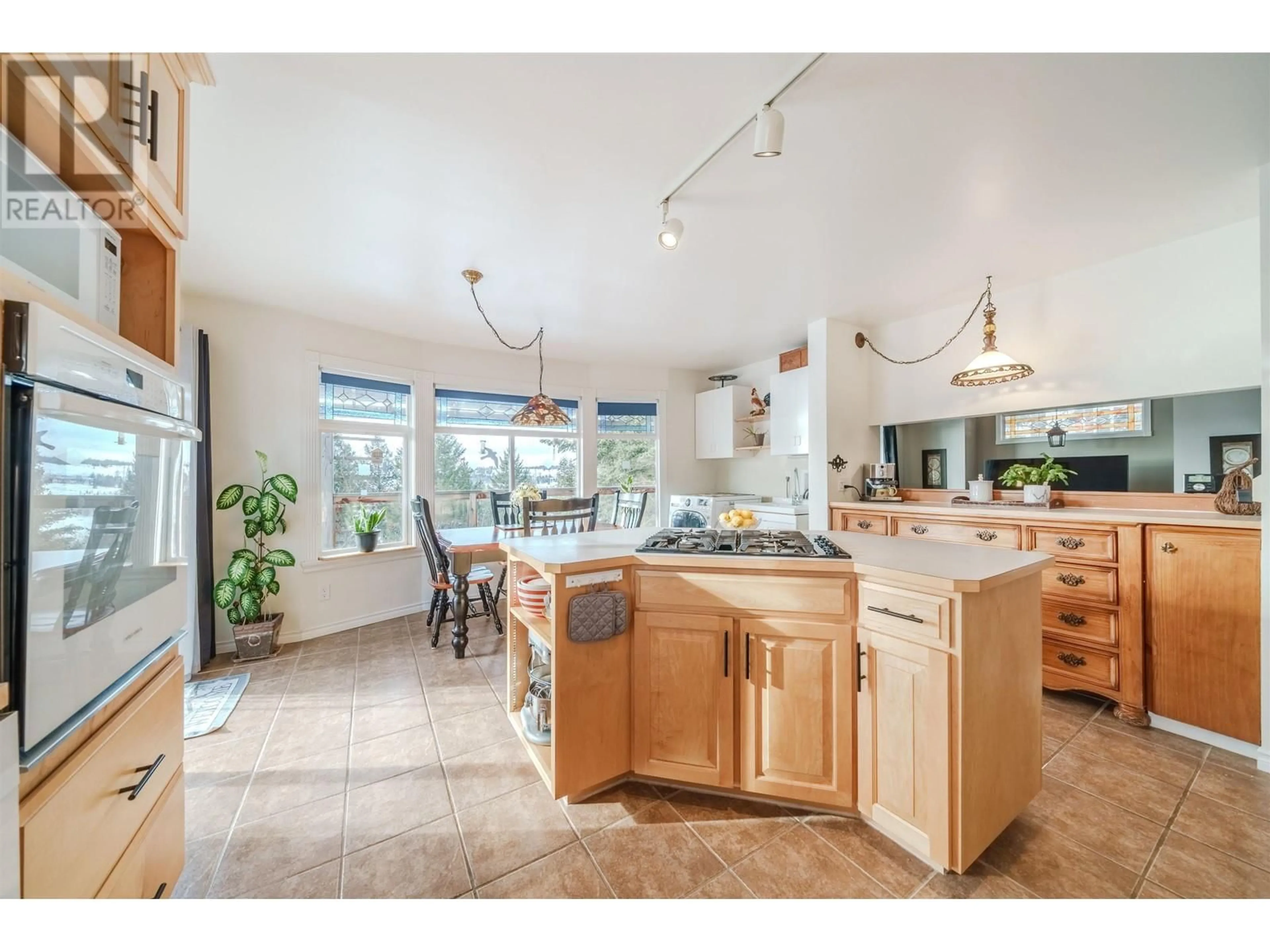 Open concept kitchen, ceramic/tile floor for 5012 BLOCK DRIVE, 108 Mile Ranch British Columbia V0K2Z0