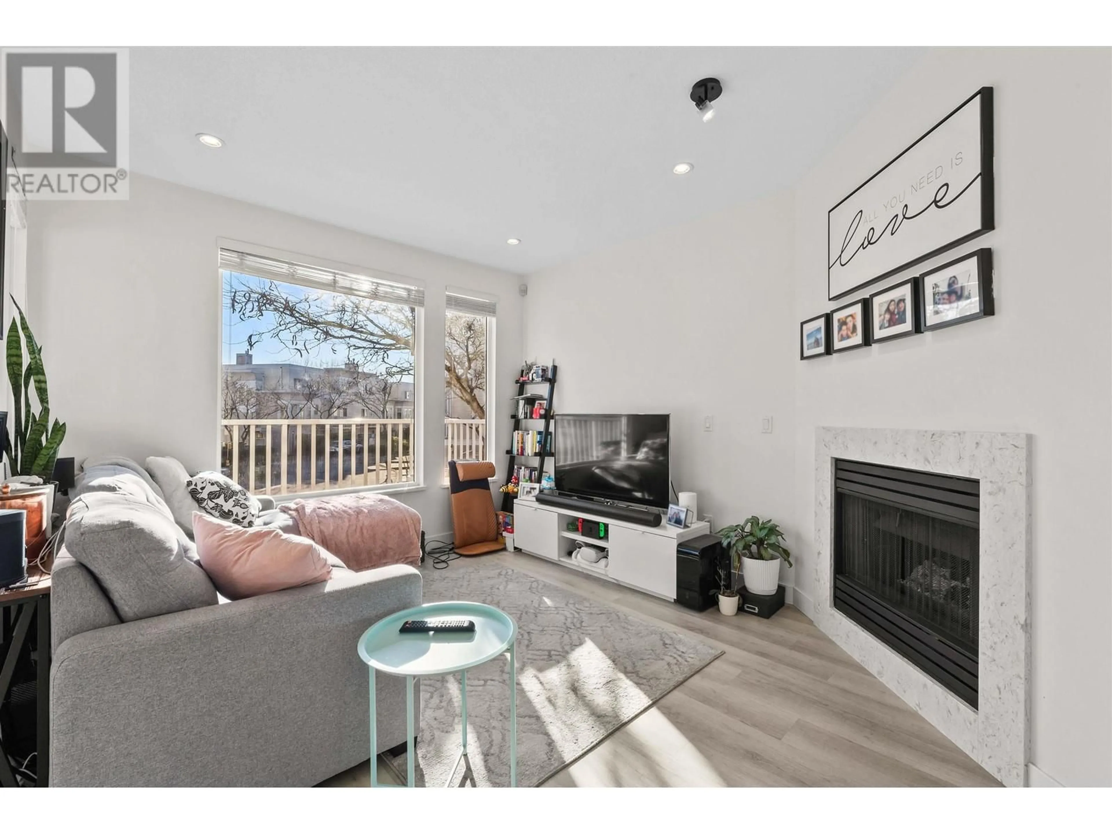 Living room with furniture, wood/laminate floor for 22 12331 MCNEELY DRIVE, Richmond British Columbia V6V2S3