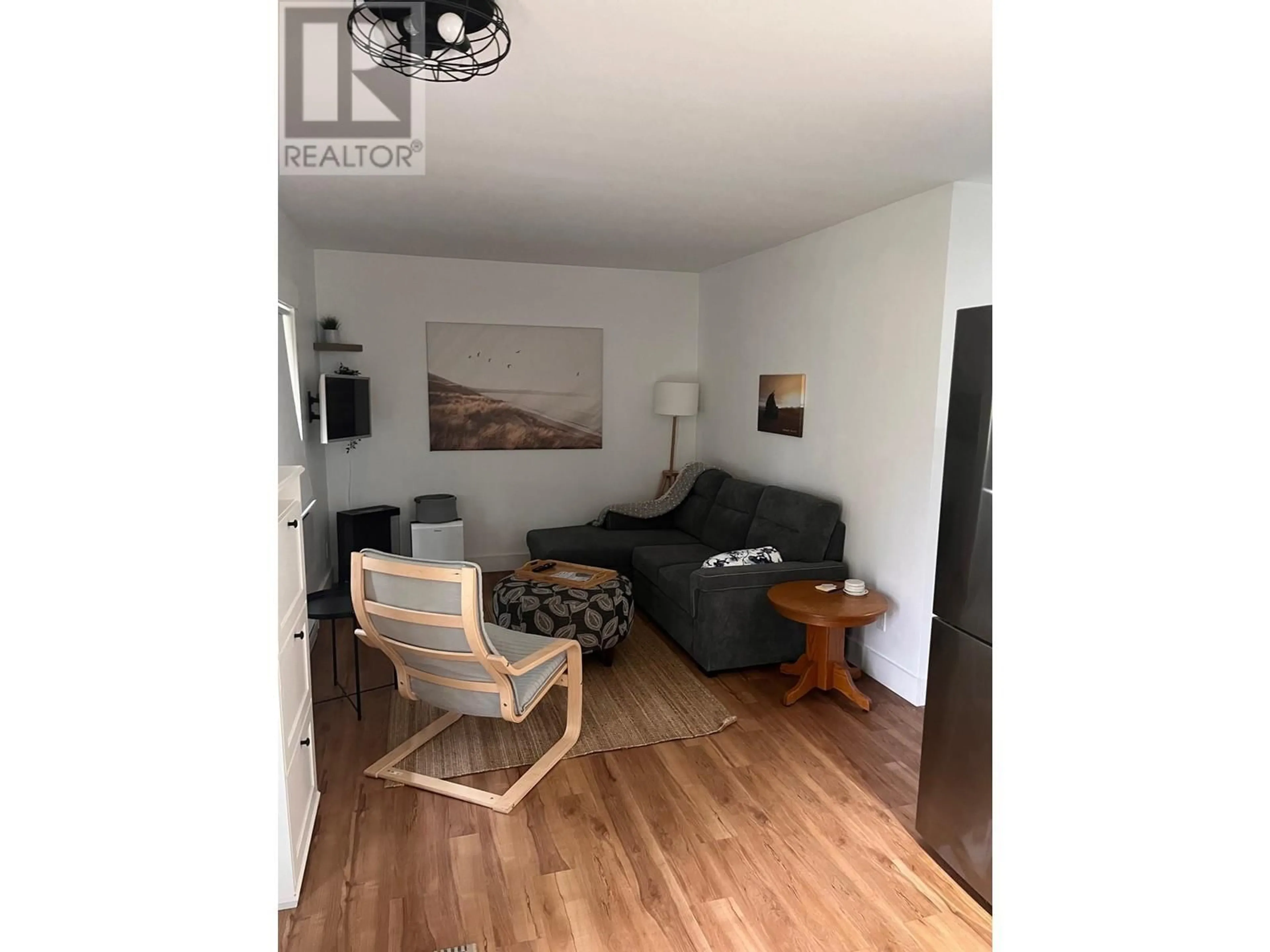 Living room with furniture, wood/laminate floor for 5683 MEDUSA STREET, Sechelt British Columbia V0N3A0