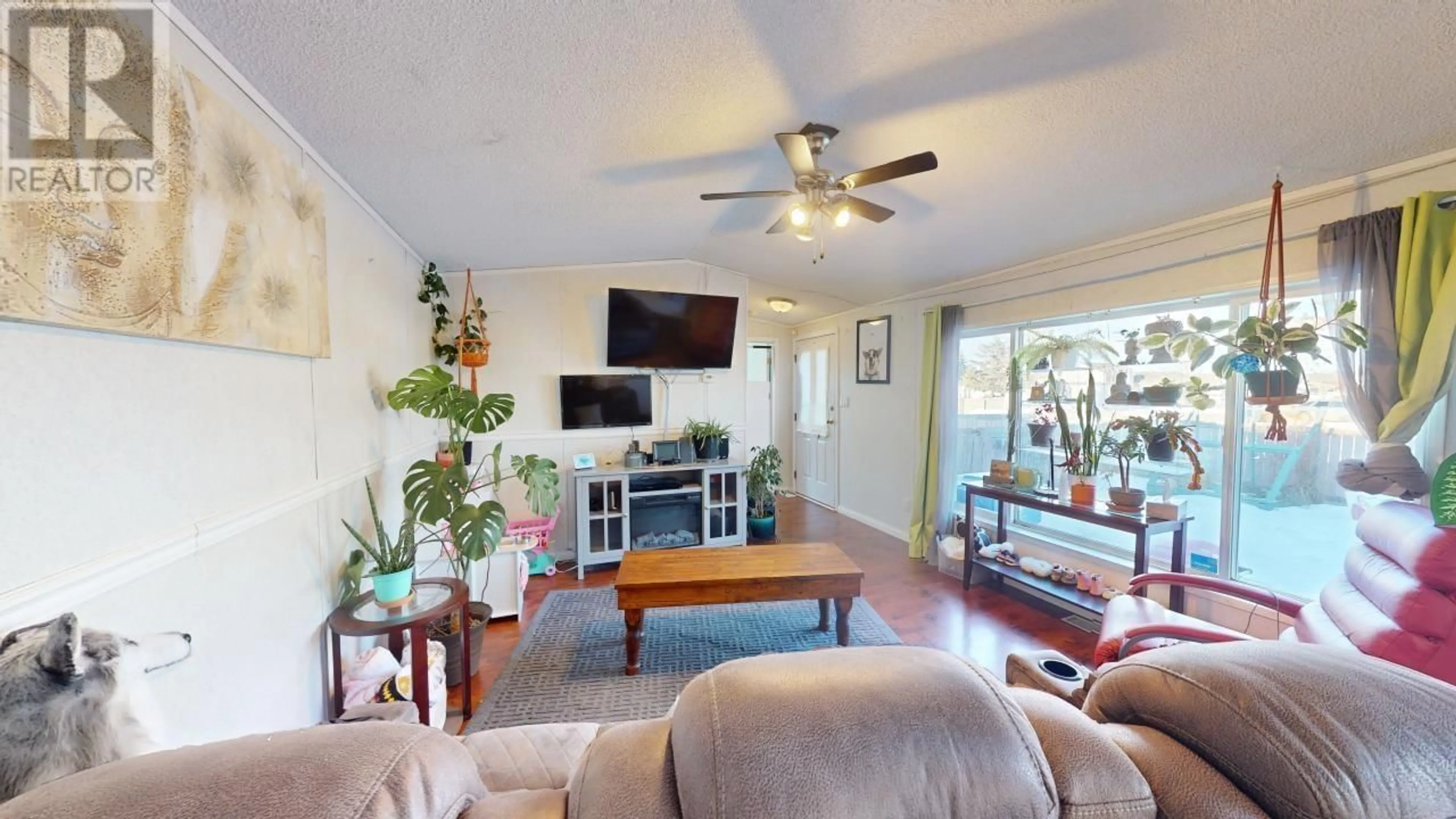 Living room with furniture, wood/laminate floor for 127 8420 ALASKA ROAD, Fort St. John British Columbia V1J4J6