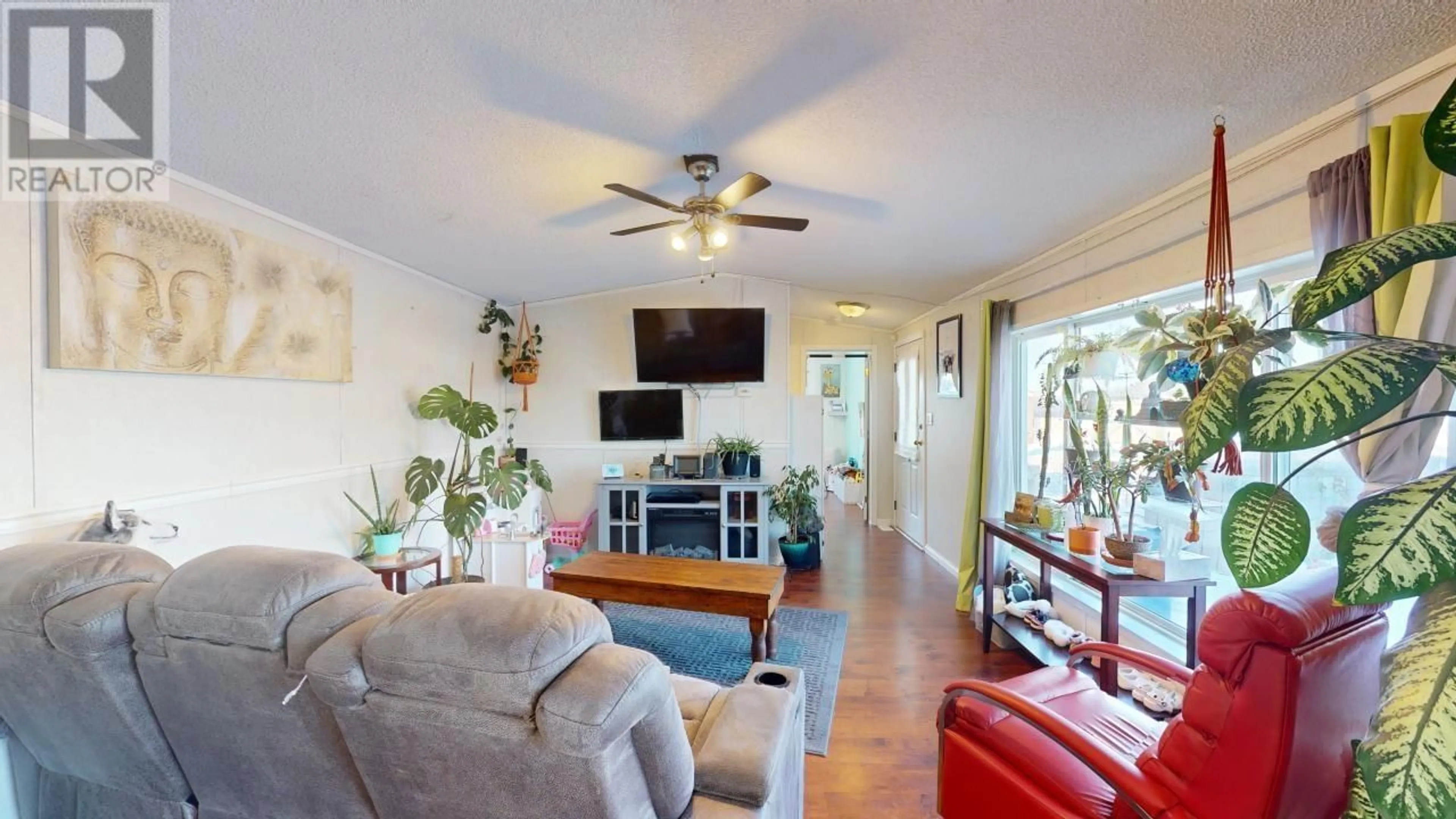 Living room with furniture, wood/laminate floor for 127 8420 ALASKA ROAD, Fort St. John British Columbia V1J4J6