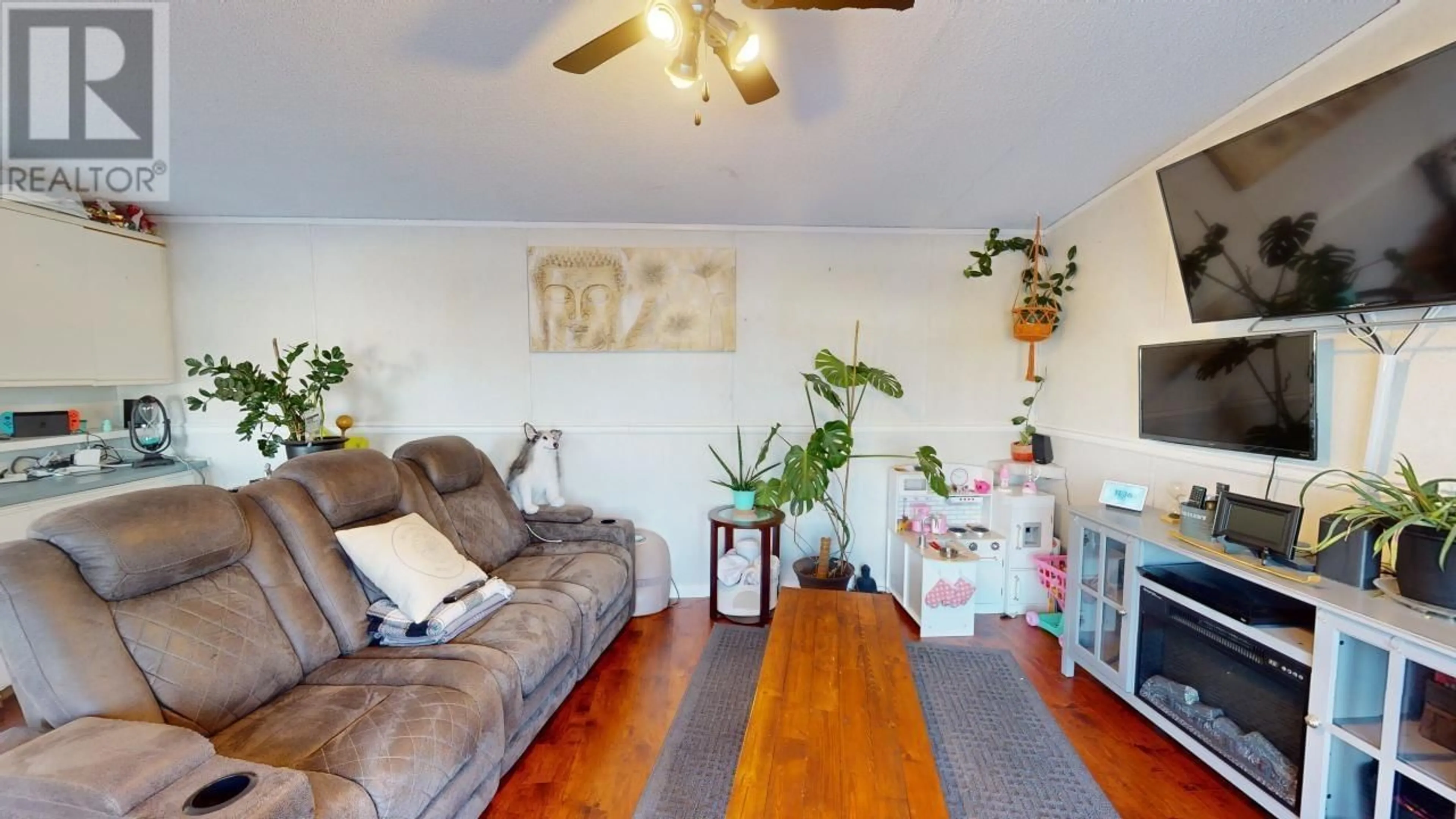 Living room with furniture, wood/laminate floor for 127 8420 ALASKA ROAD, Fort St. John British Columbia V1J4J6