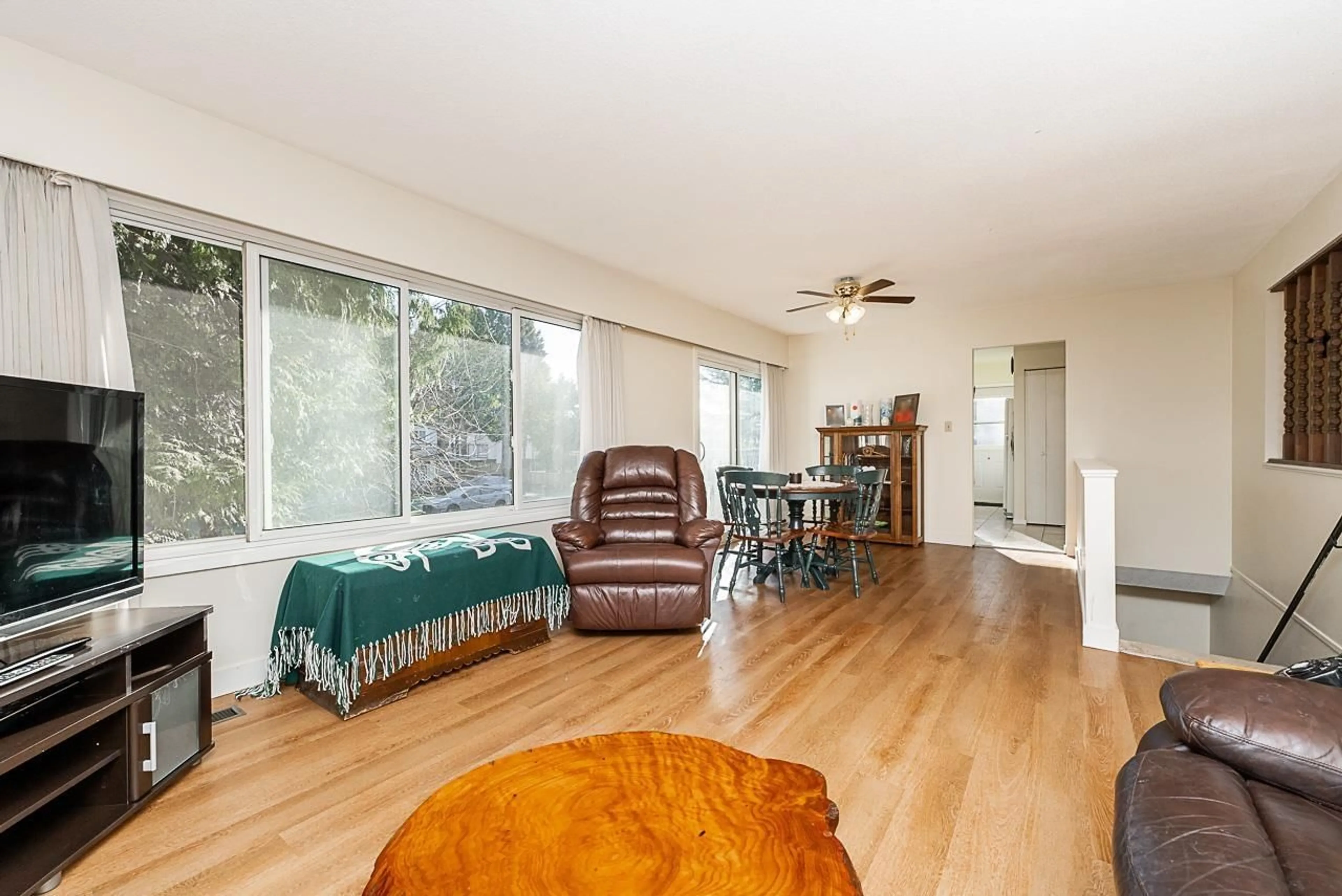 Living room with furniture, wood/laminate floor for 8083 112A STREET, Delta British Columbia V4C4Y7