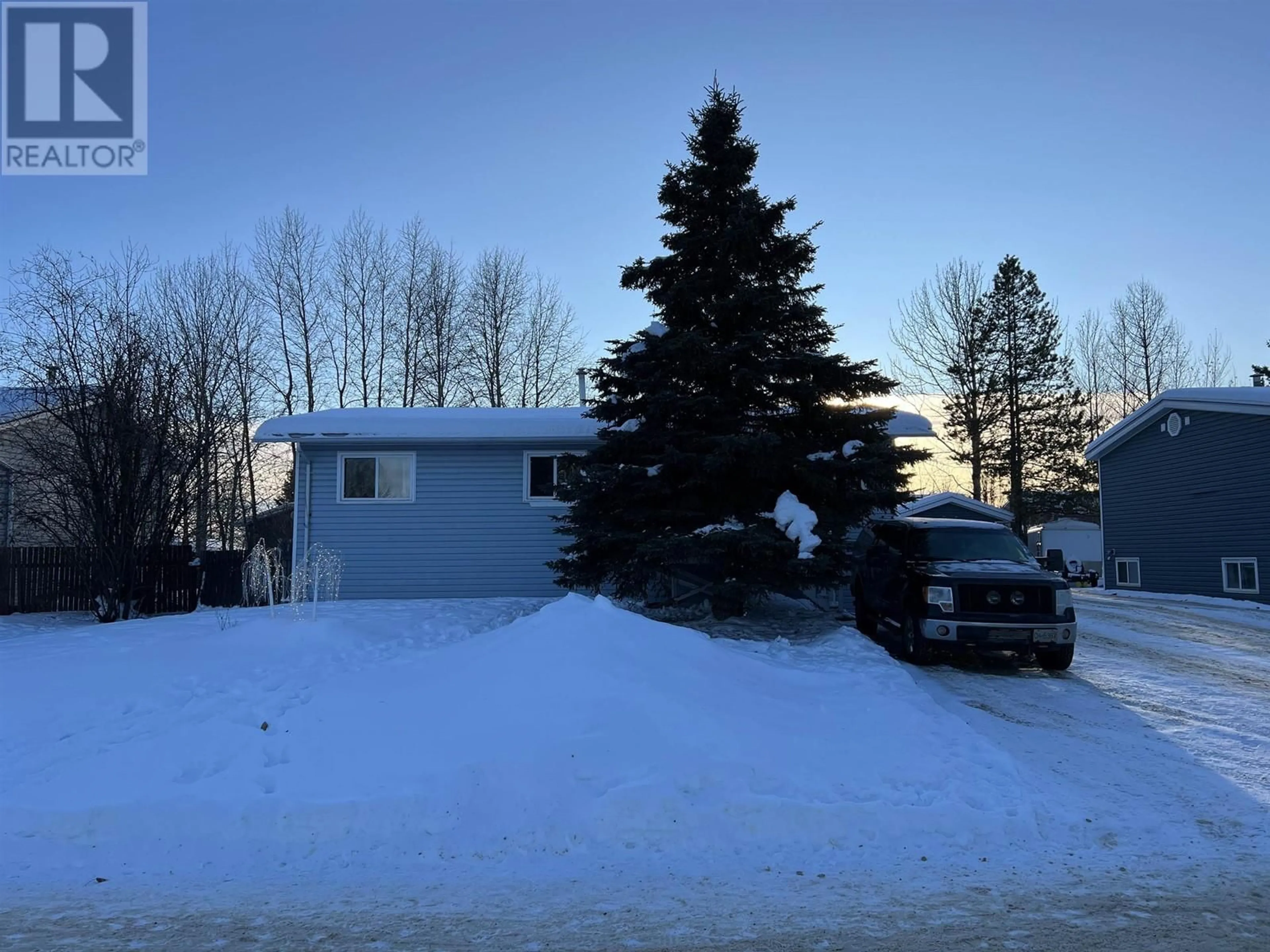 A pic from outside/outdoor area/front of a property/back of a property/a pic from drone, mountain view for 4015 E 53 AVENUE, Fort Nelson British Columbia V0C1R0