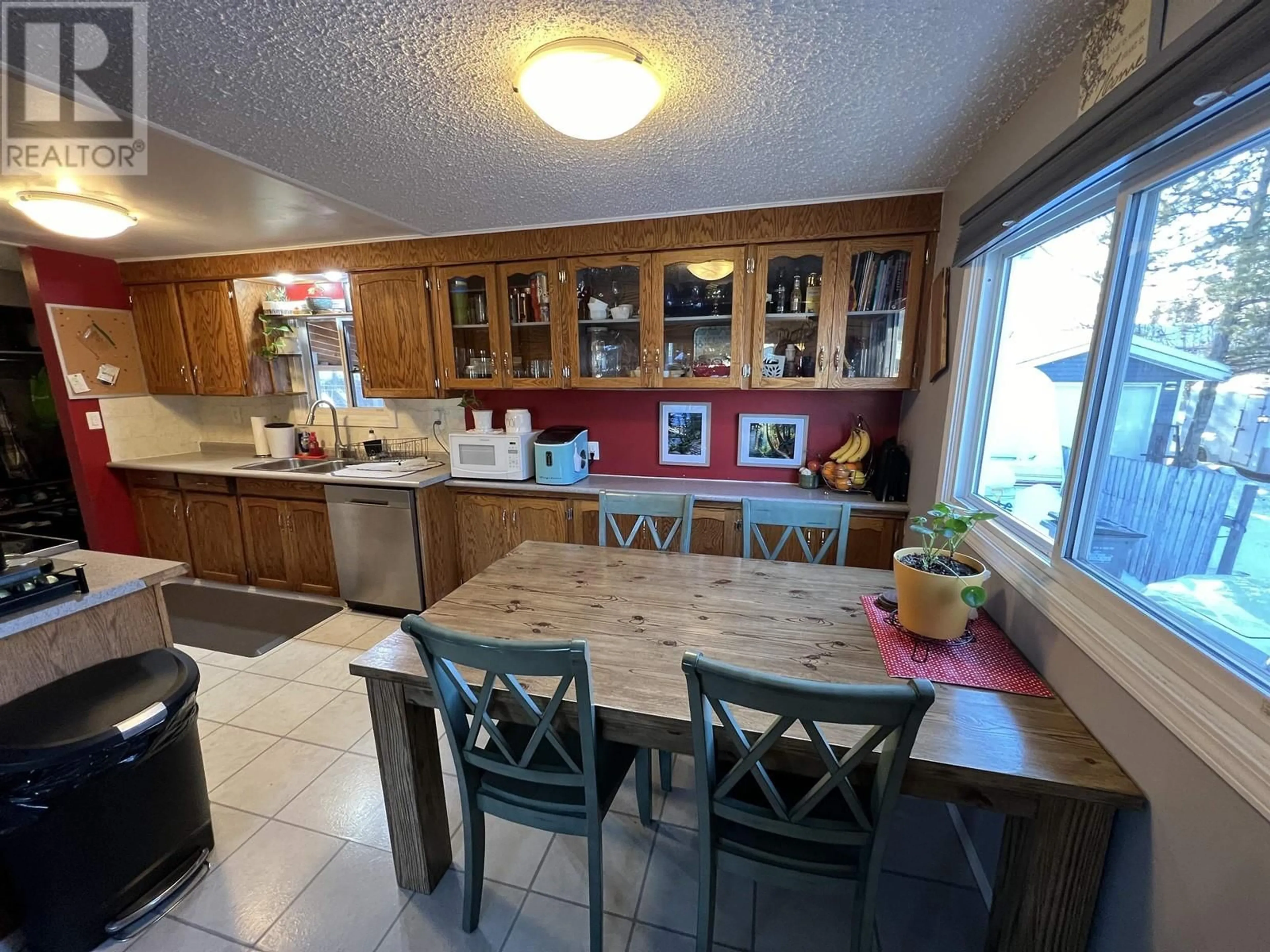 Open concept kitchen, ceramic/tile floor for 4015 E 53 AVENUE, Fort Nelson British Columbia V0C1R0