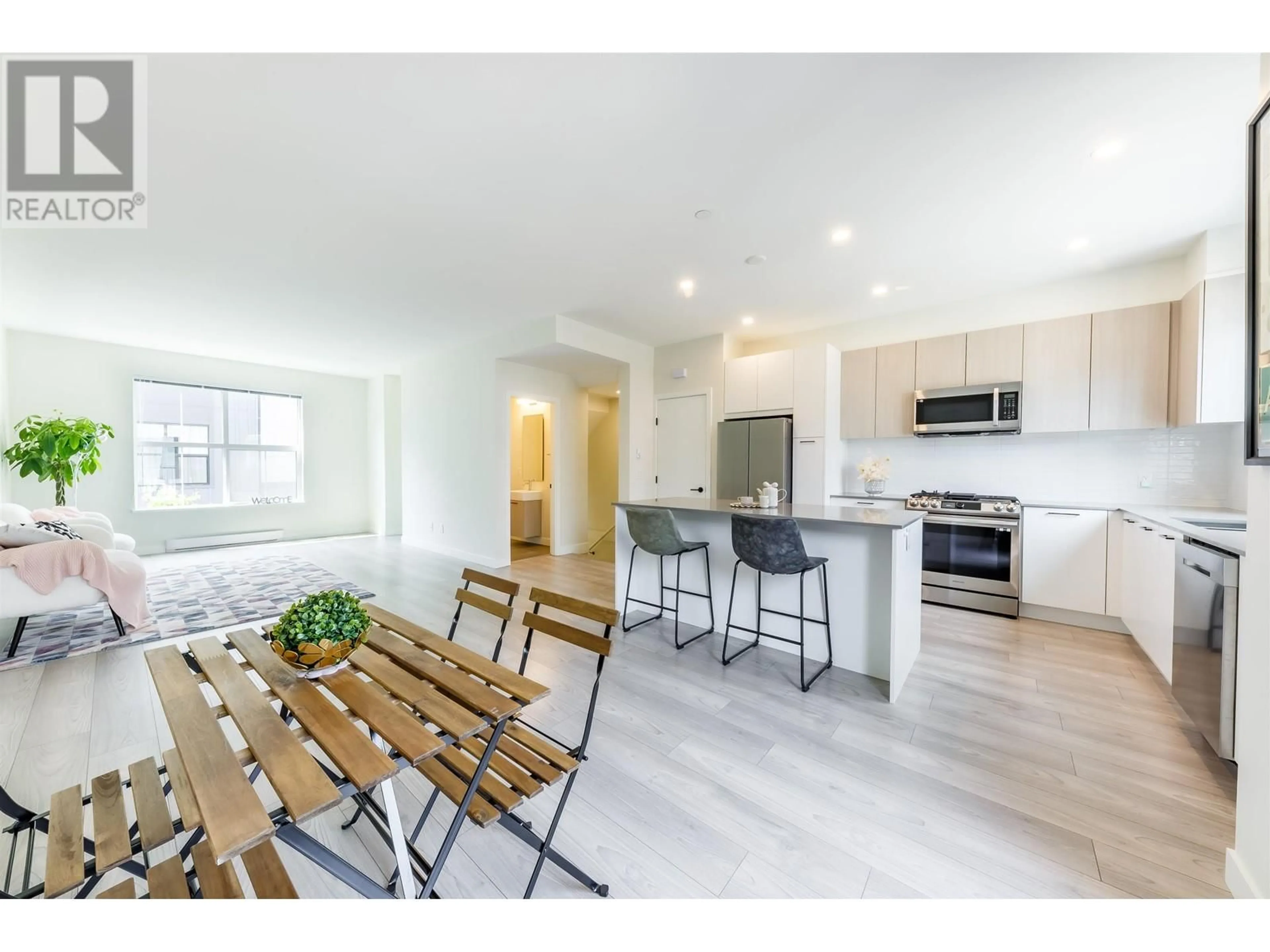 Open concept kitchen, wood/laminate floor for 135 - 488 FURNESS STREET, New Westminster British Columbia V3M0M1
