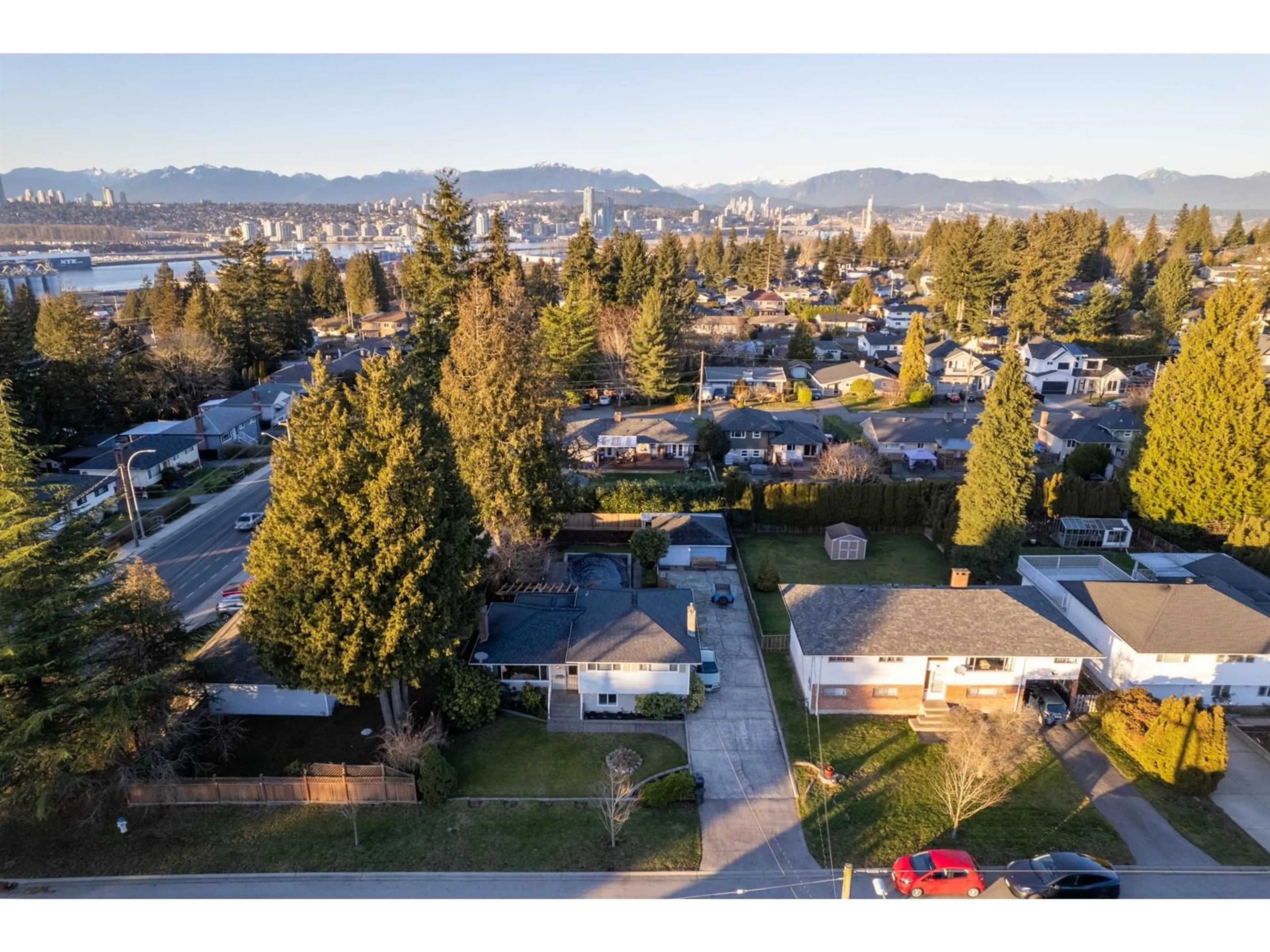 A pic from outside/outdoor area/front of a property/back of a property/a pic from drone, mountain view for 11423 94 AVENUE, Delta British Columbia V4C3R3