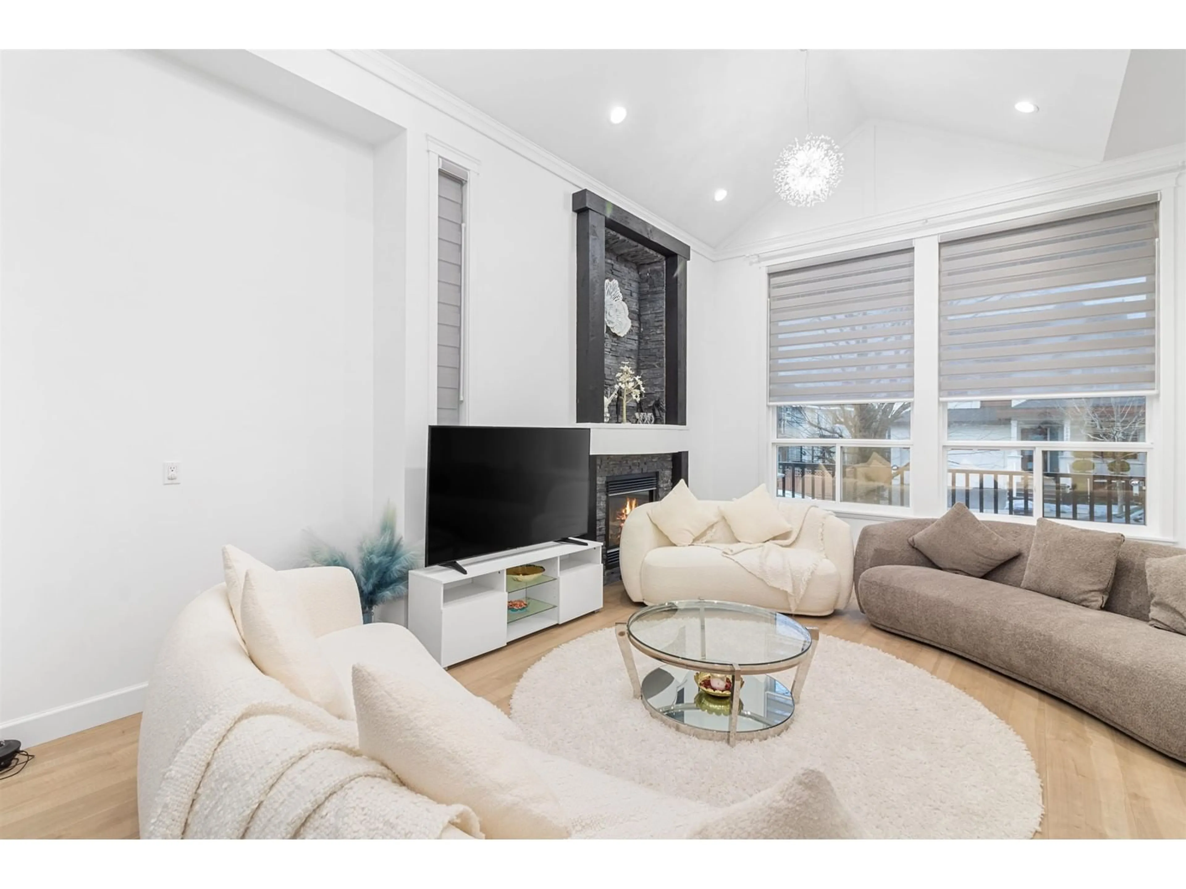 Living room with furniture, wood/laminate floor for 18358 67 AVENUE, Surrey British Columbia V3S1E5