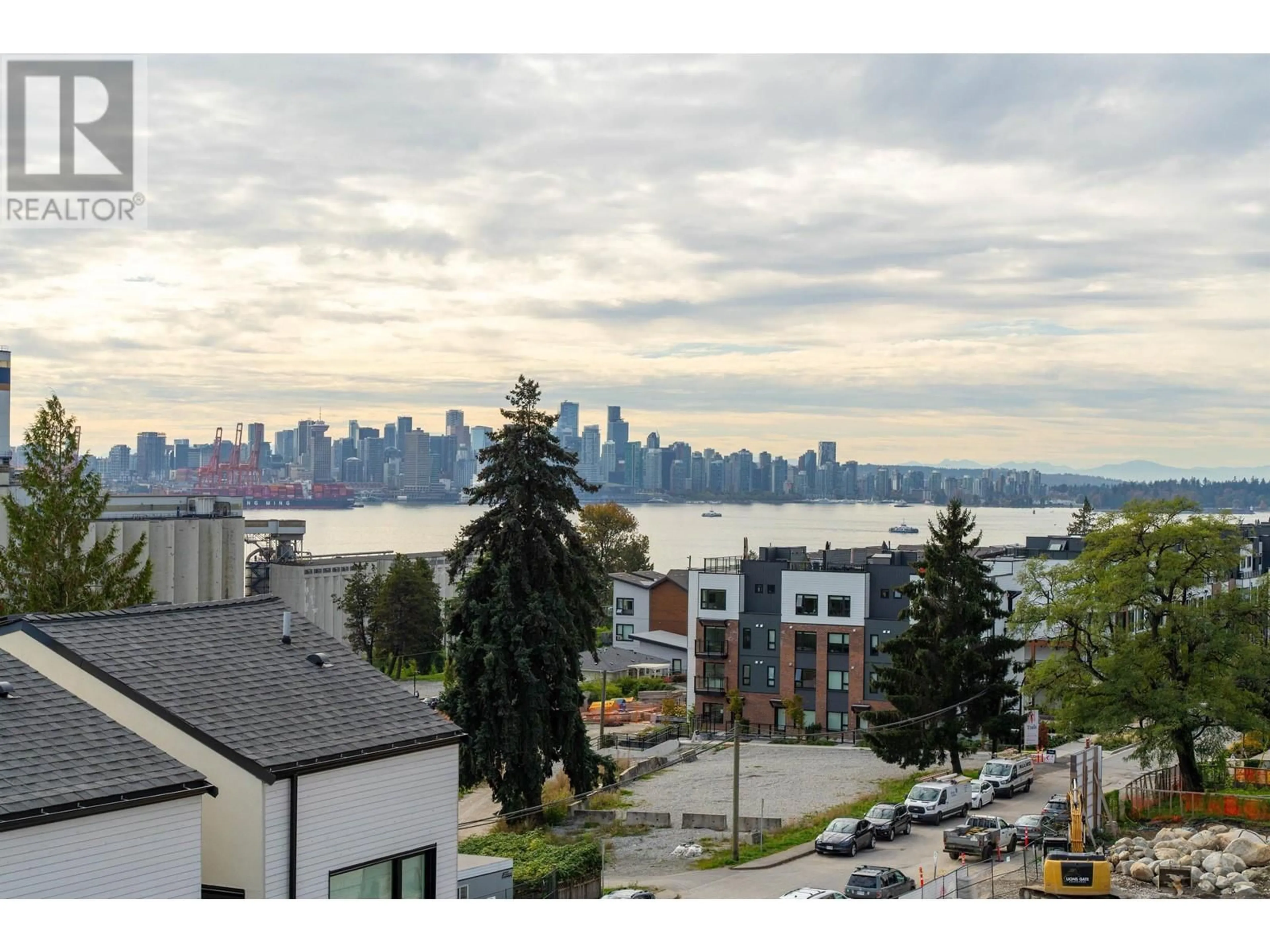 A pic from outside/outdoor area/front of a property/back of a property/a pic from drone, city buildings view from balcony for 228 650 E 2ND STREET, North Vancouver British Columbia V7M1E3