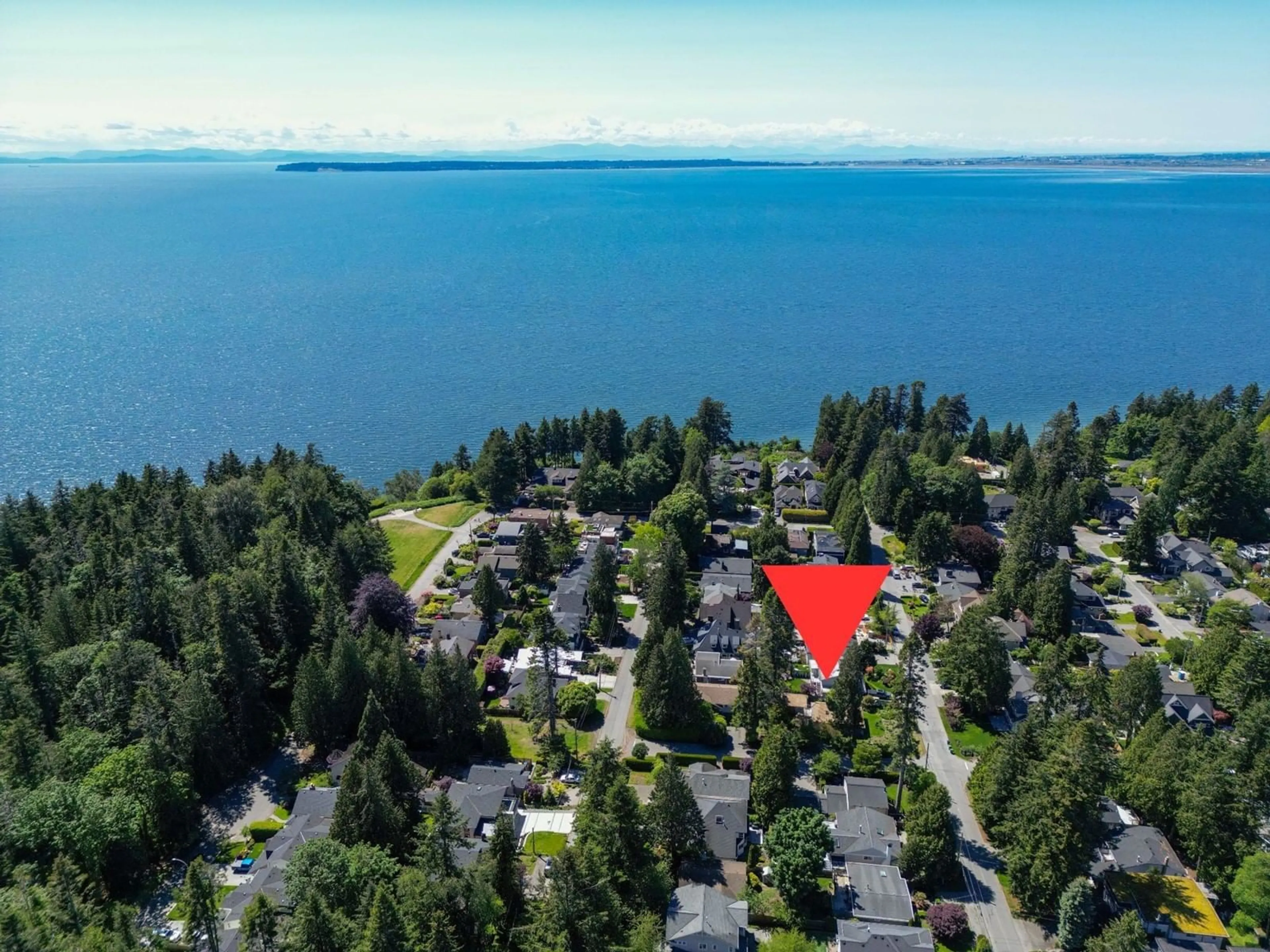 A pic from outside/outdoor area/front of a property/back of a property/a pic from drone, water/lake/river/ocean view for 12694 15 AVENUE, Surrey British Columbia V4A1K3