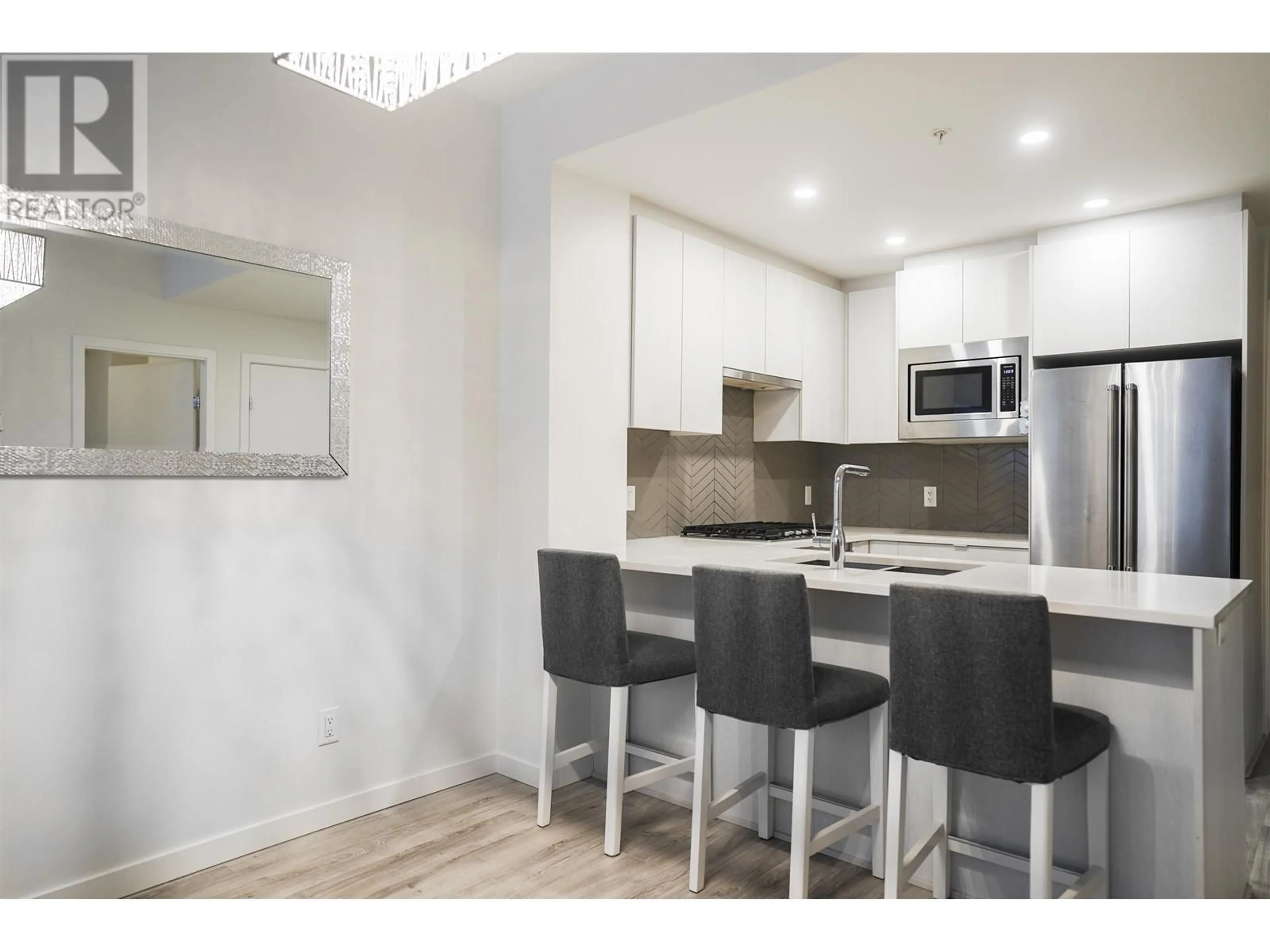 Open concept kitchen, wood/laminate floor for 207 717 BRESLAY STREET, Coquitlam British Columbia V3J0J3