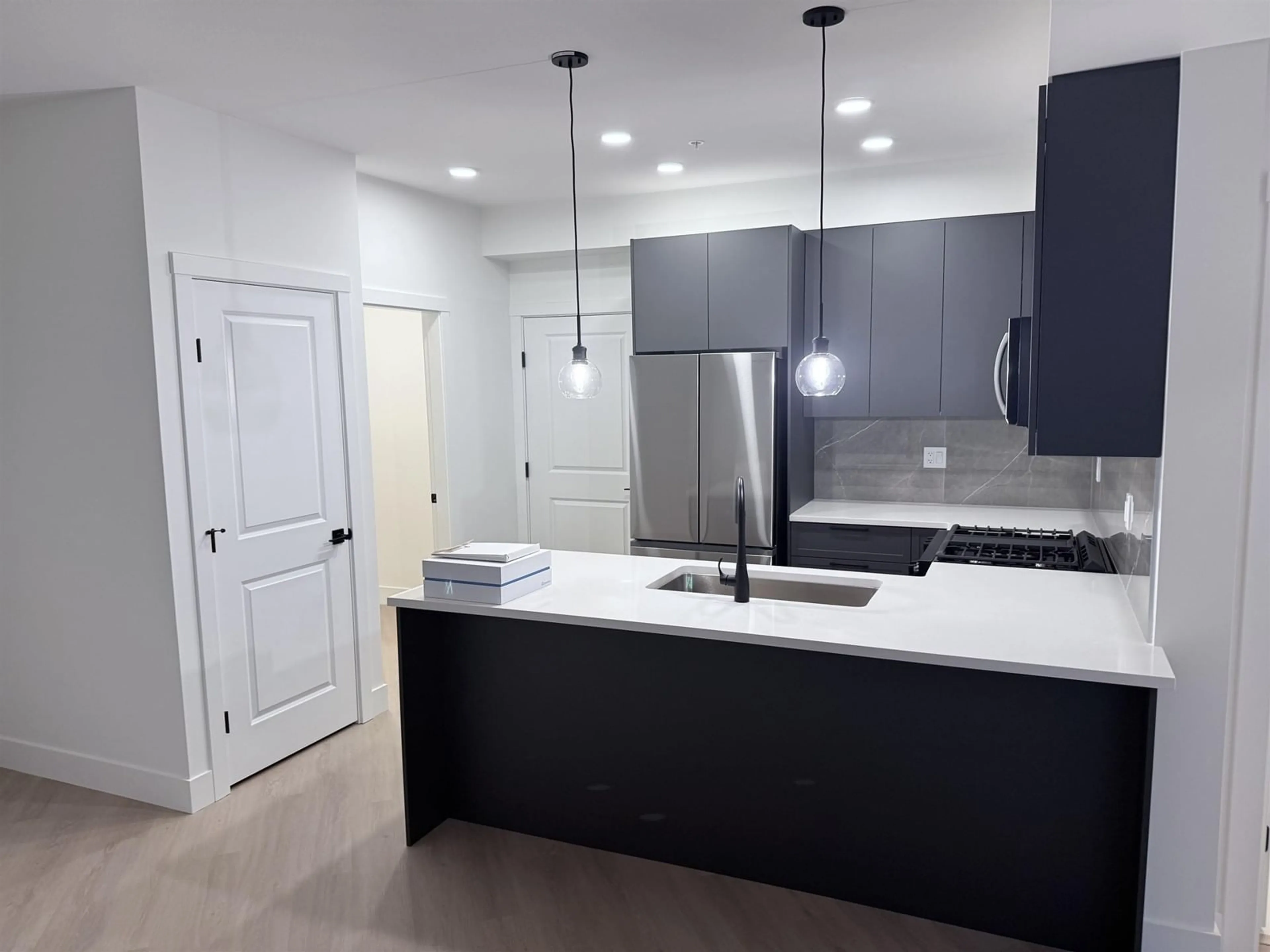 Open concept kitchen, unknown for 217 - 3480 146A, Surrey British Columbia V3S5L4