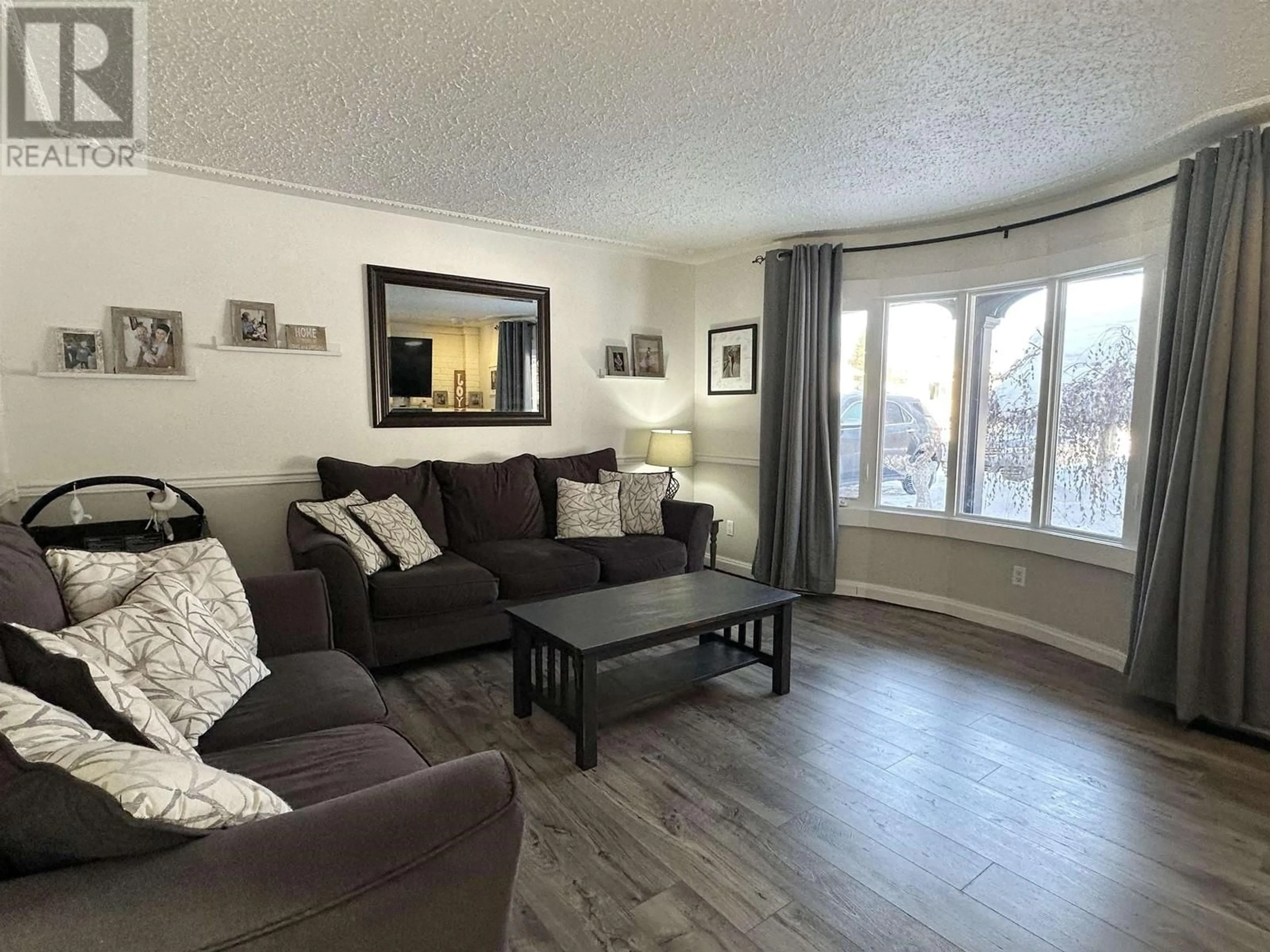 Living room with furniture, wood/laminate floor for 4621 CROCUS CRESCENT, Prince George British Columbia V2K3H4