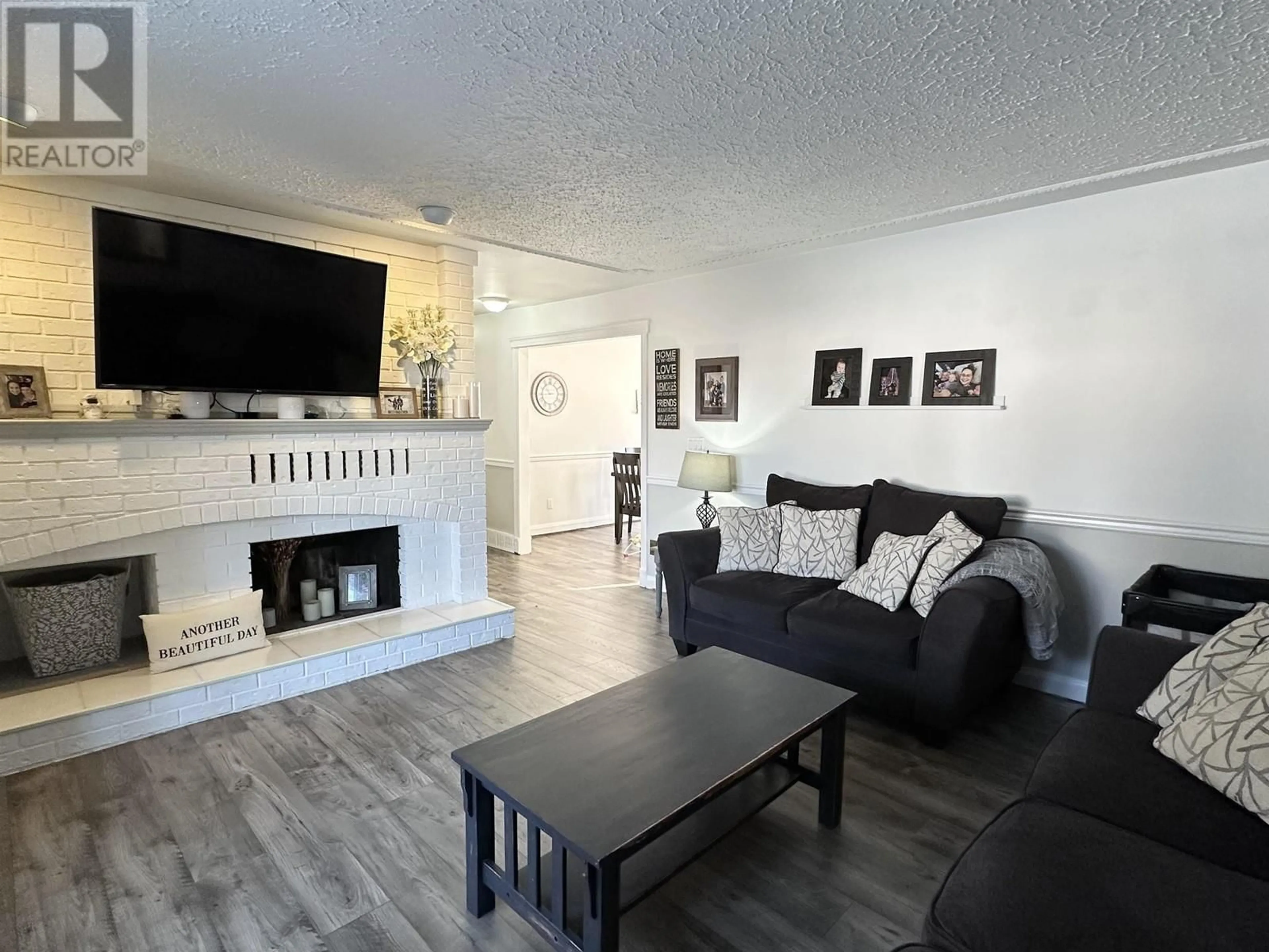 Living room with furniture, wood/laminate floor for 4621 CROCUS CRESCENT, Prince George British Columbia V2K3H4