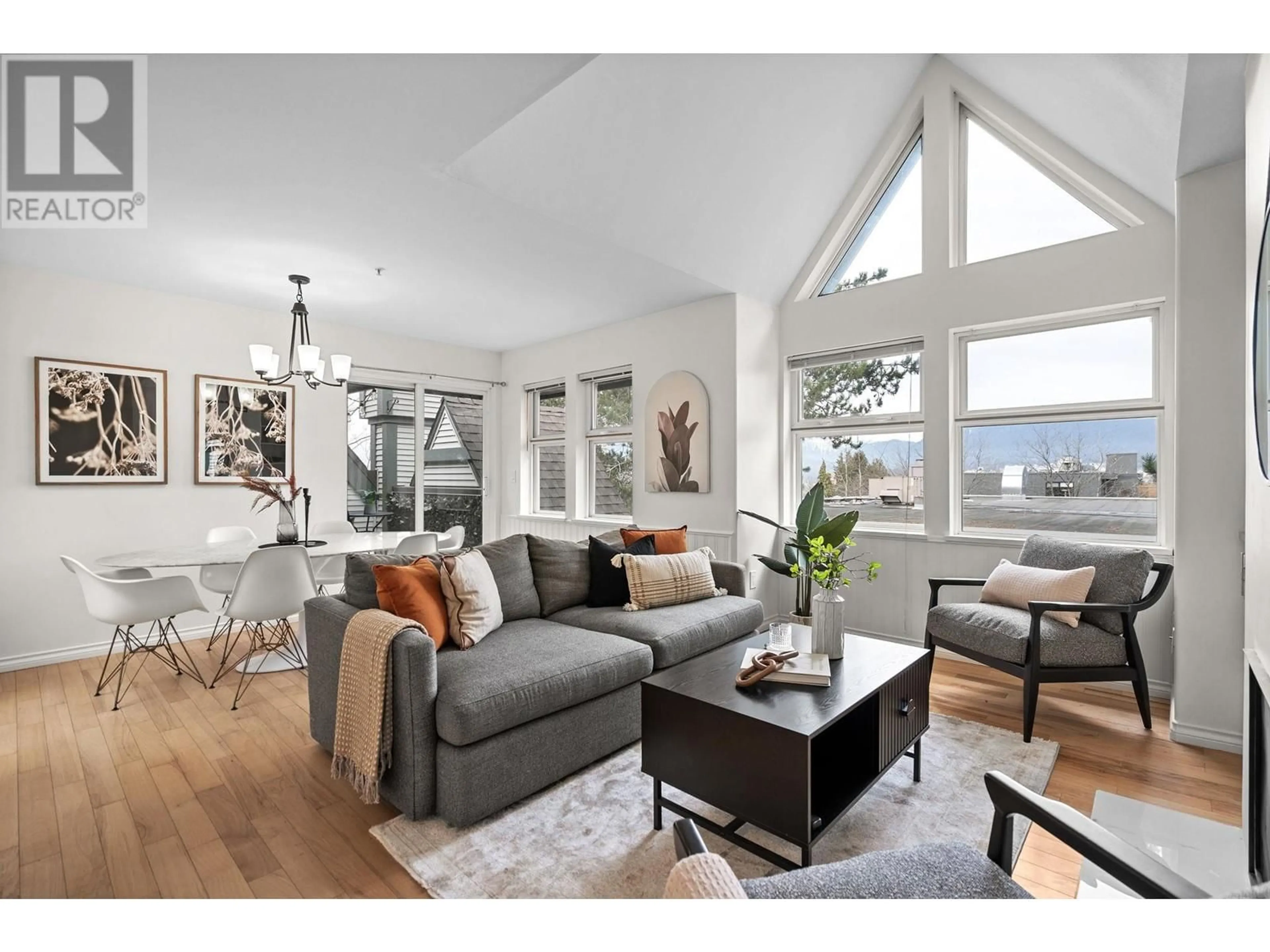 Living room with furniture, wood/laminate floor for PH1 1915 E GEORGIA STREET, Vancouver British Columbia V5L2B7