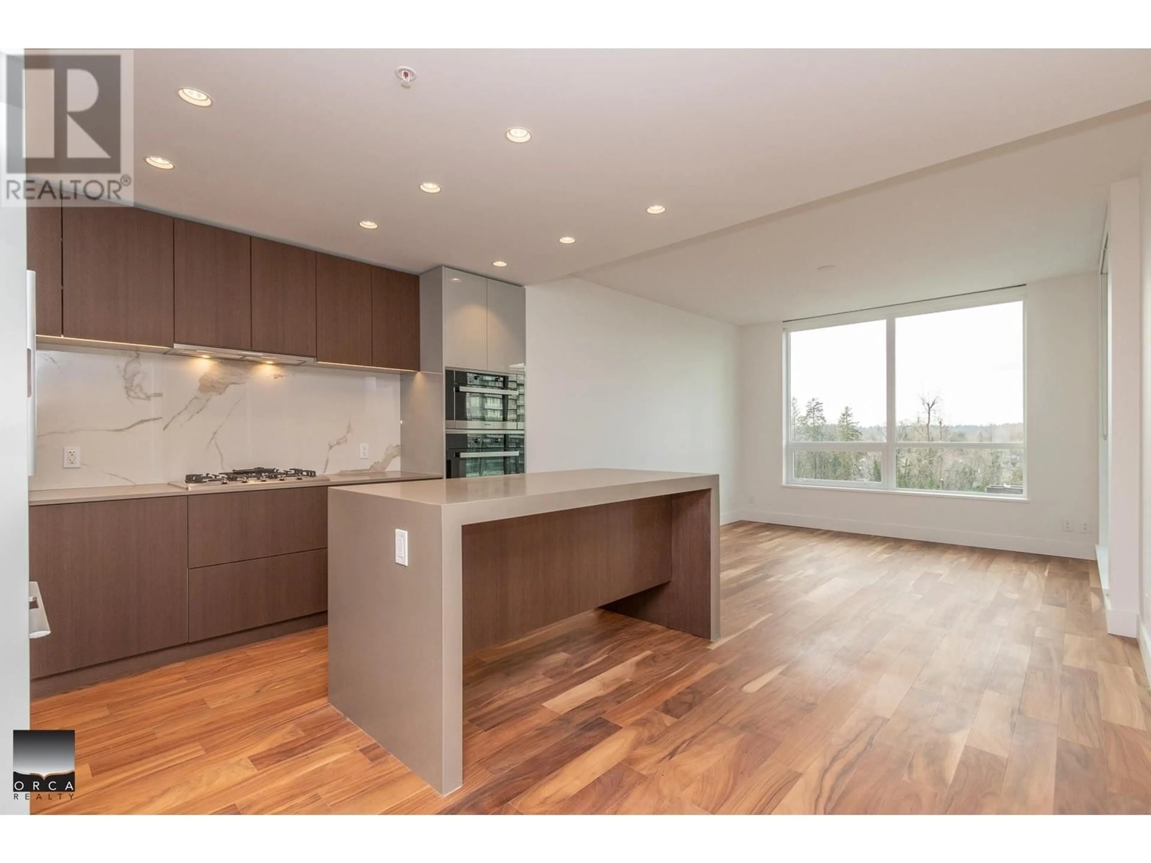 Open concept kitchen, wood/laminate floor for 605 1675 LIONS GATE LANE, North Vancouver British Columbia V7P3B4