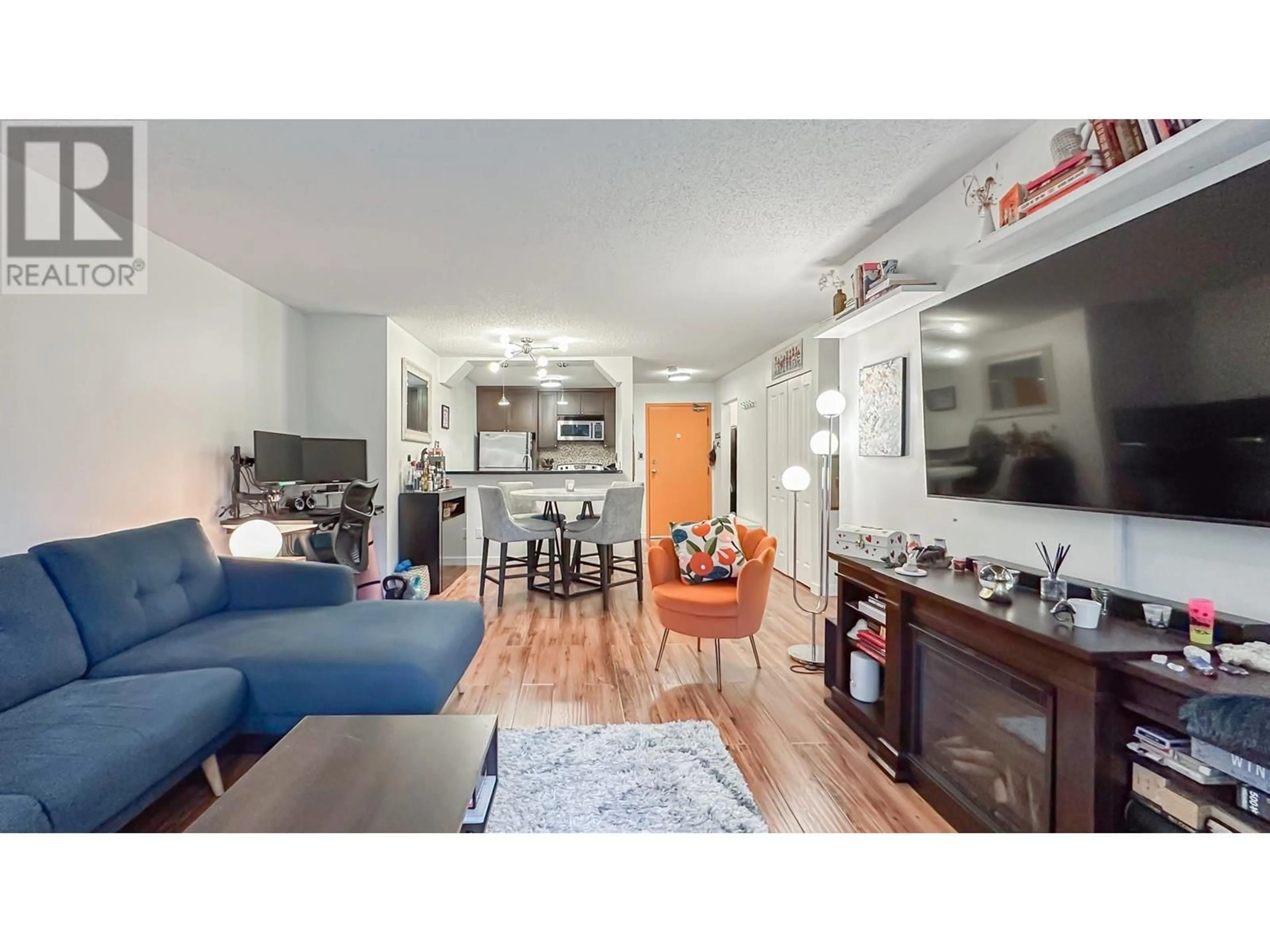 Living room with furniture, wood/laminate floor for 108 - 1955 WOODWAY PLACE, Burnaby British Columbia V5B4S5
