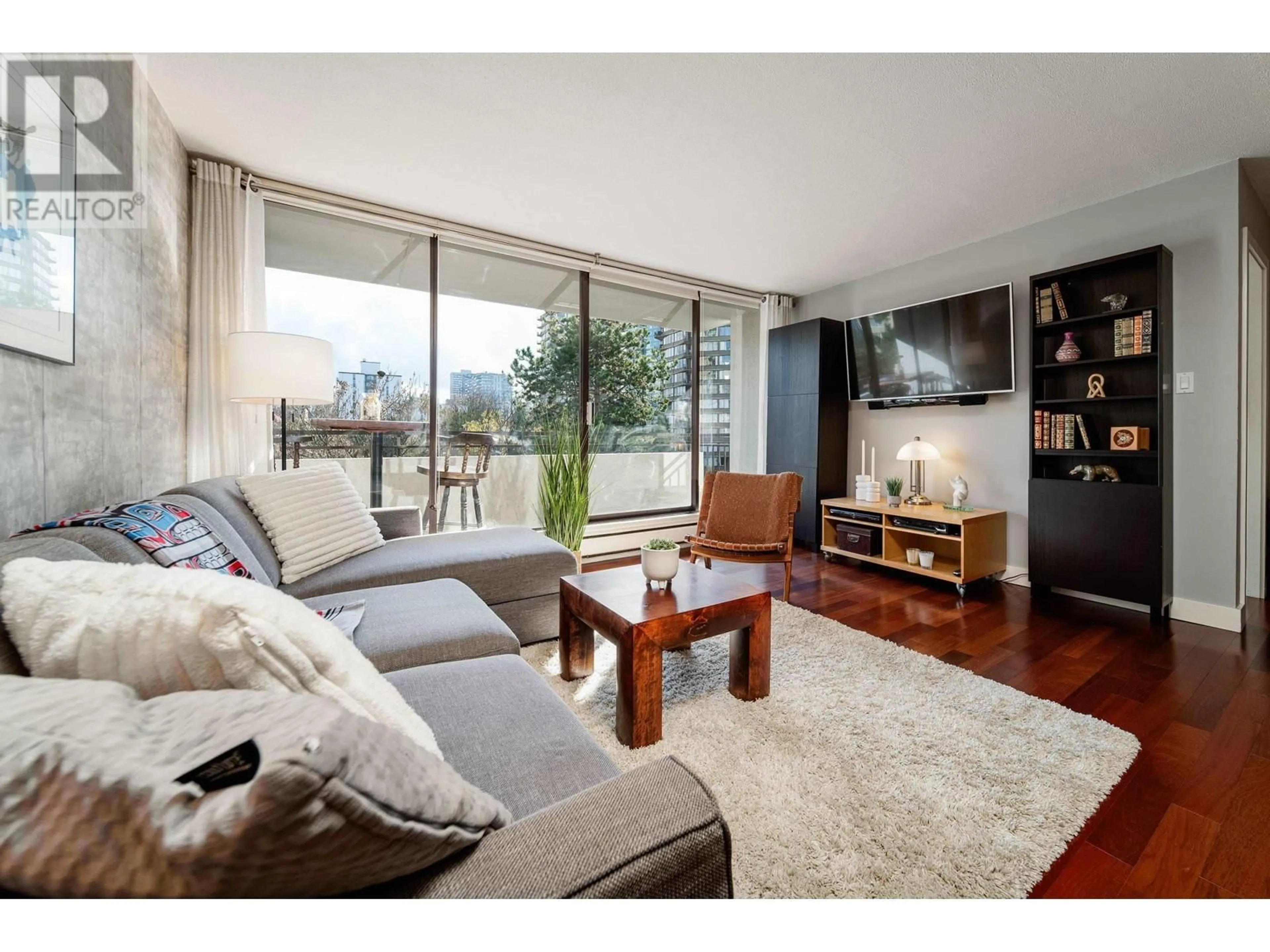 Living room with furniture, wood/laminate floor for 706 1725 PENDRELL STREET, Vancouver British Columbia V6G2X7