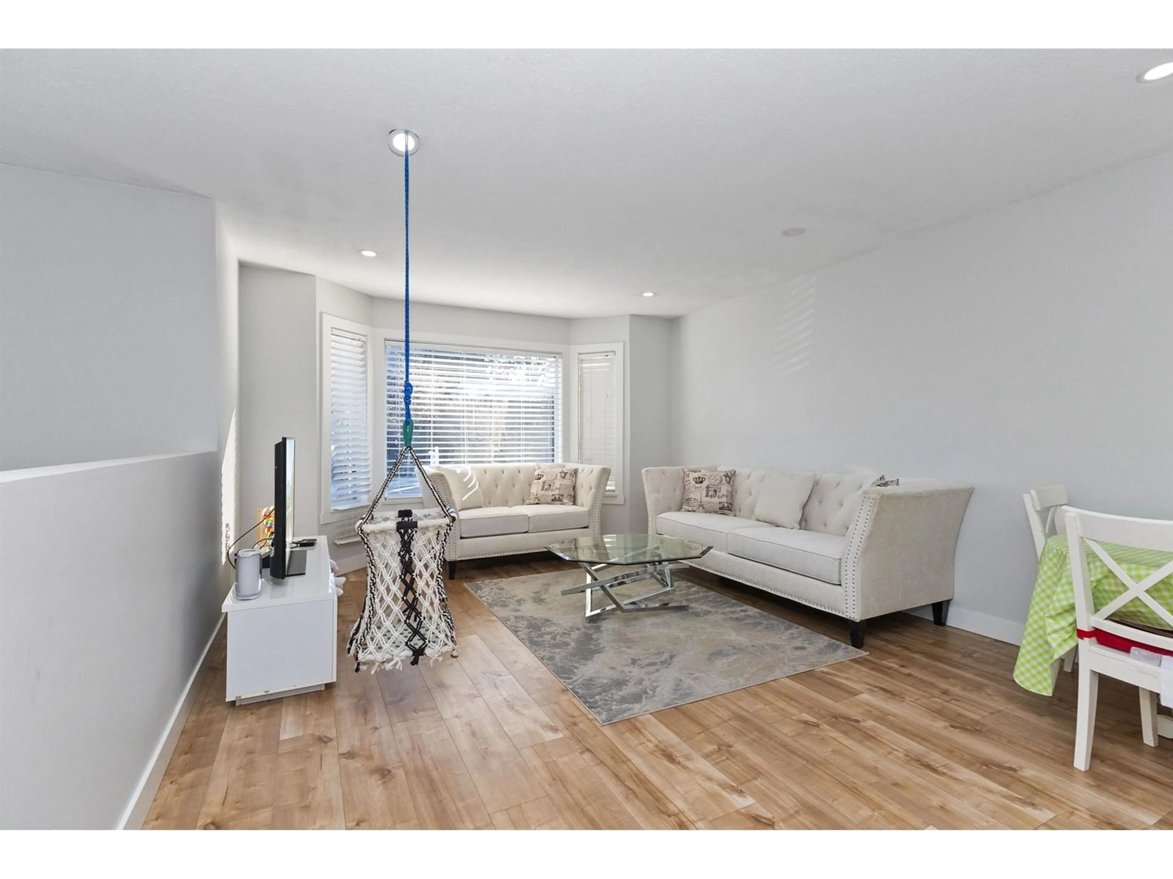 Living room with furniture, wood/laminate floor for 8221 MILLER, Mission British Columbia V2V6H7