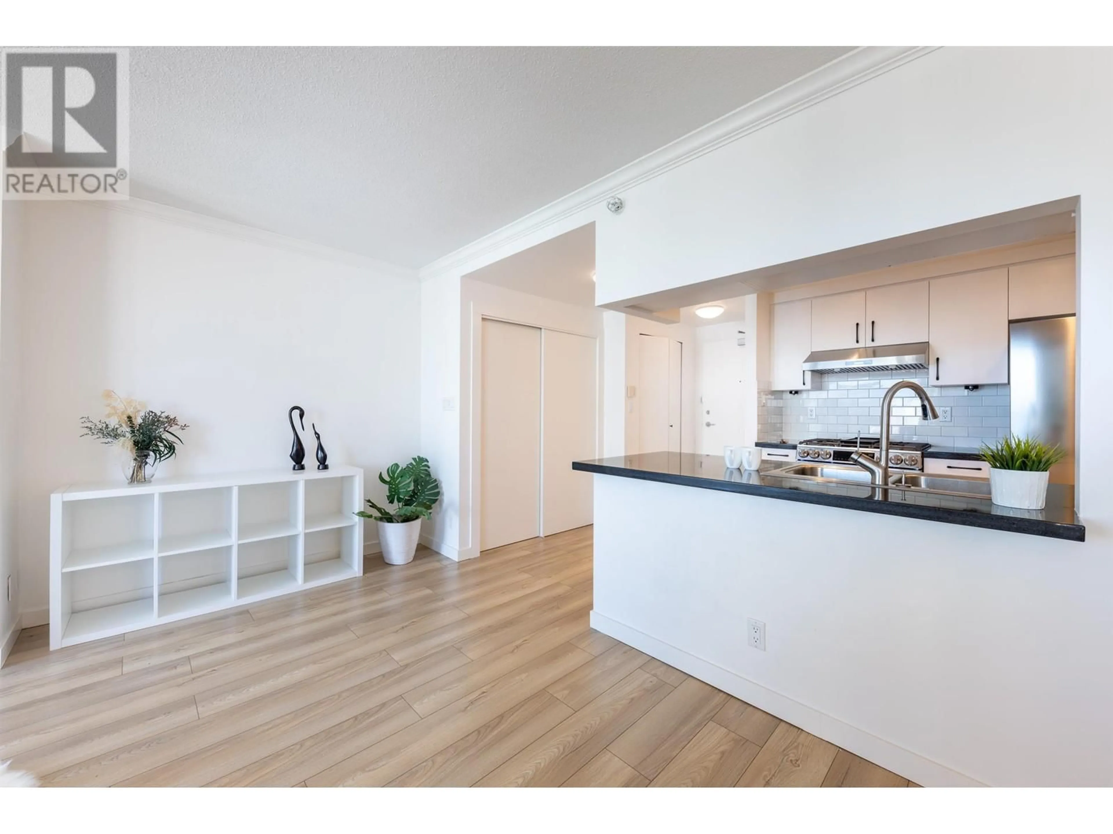 Open concept kitchen, wood/laminate floor for 3303 1199 MARINASIDE CRESCENT, Vancouver British Columbia V6Z2Y2