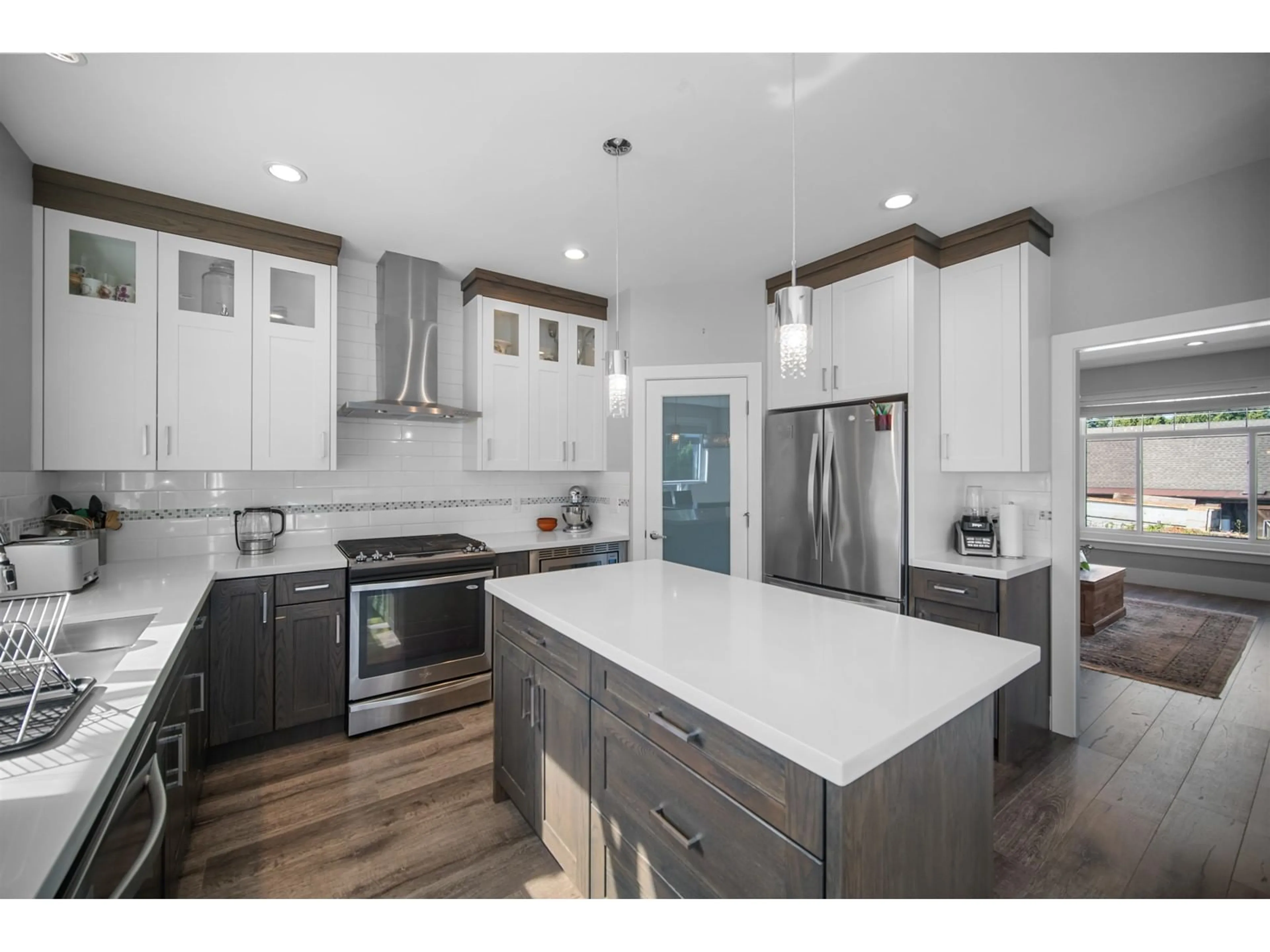 Open concept kitchen, wood/laminate floor for 6038 145 STREET, Surrey British Columbia V3S4R4