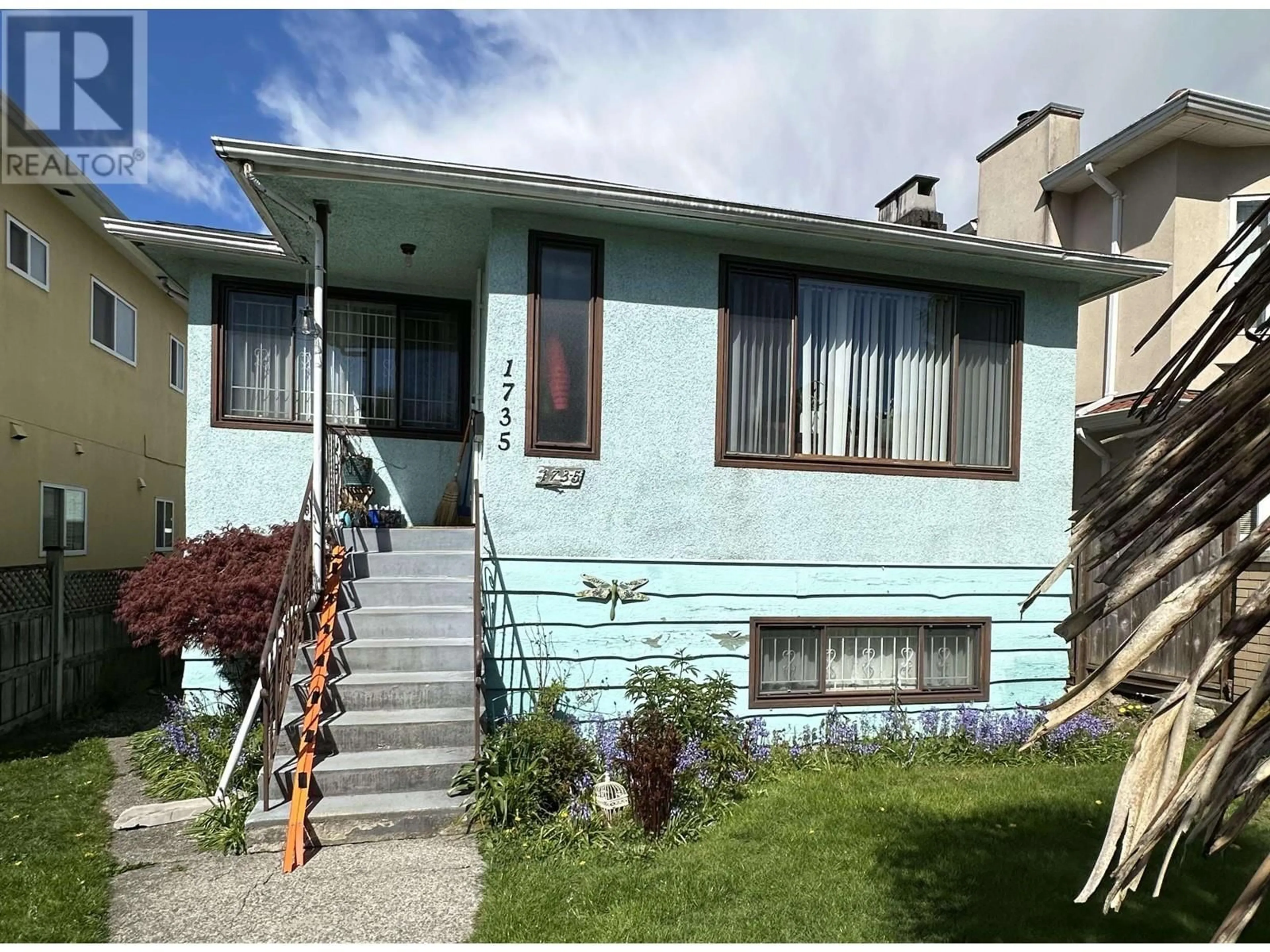 Home with vinyl exterior material, street for 1735 E 35TH AVENUE, Vancouver British Columbia V5P1B5