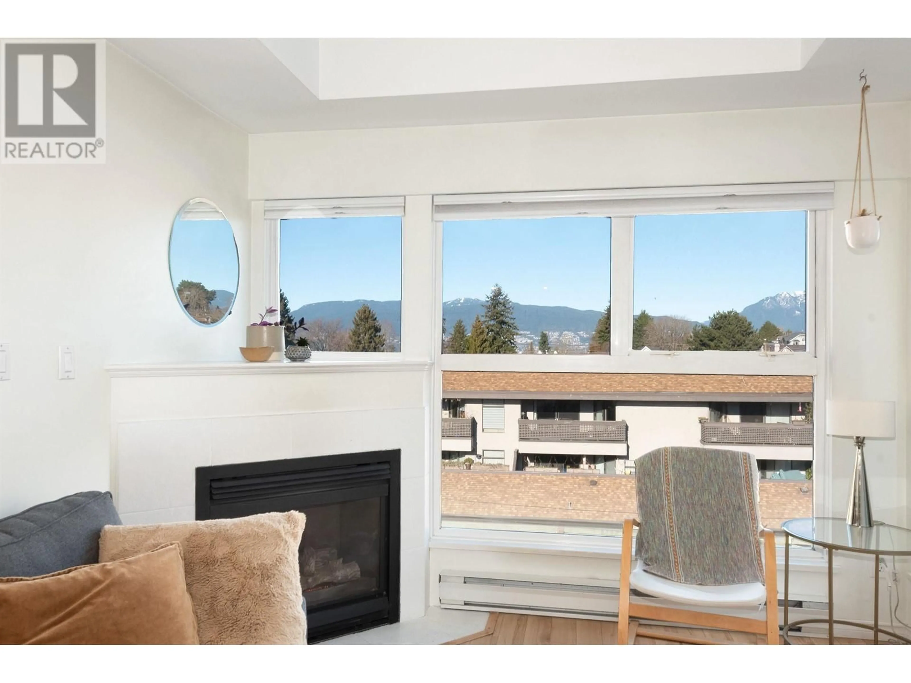 Living room with furniture, wood/laminate floor for 401 2025 STEPHENS STREET, Vancouver British Columbia V6K3W2