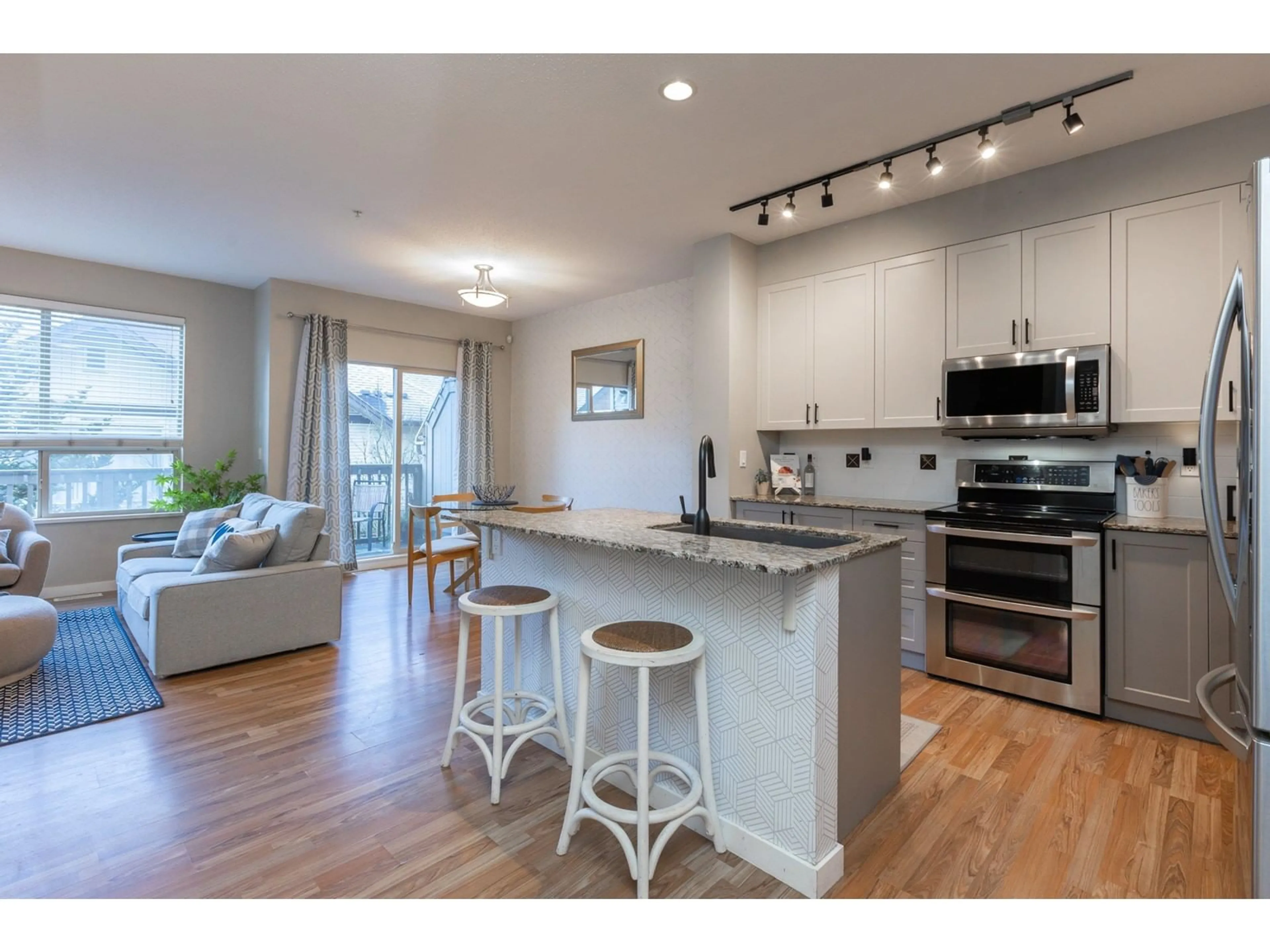 Open concept kitchen, wood/laminate floor for 62 20350 68TH AVENUE, Langley British Columbia V2Y3A5