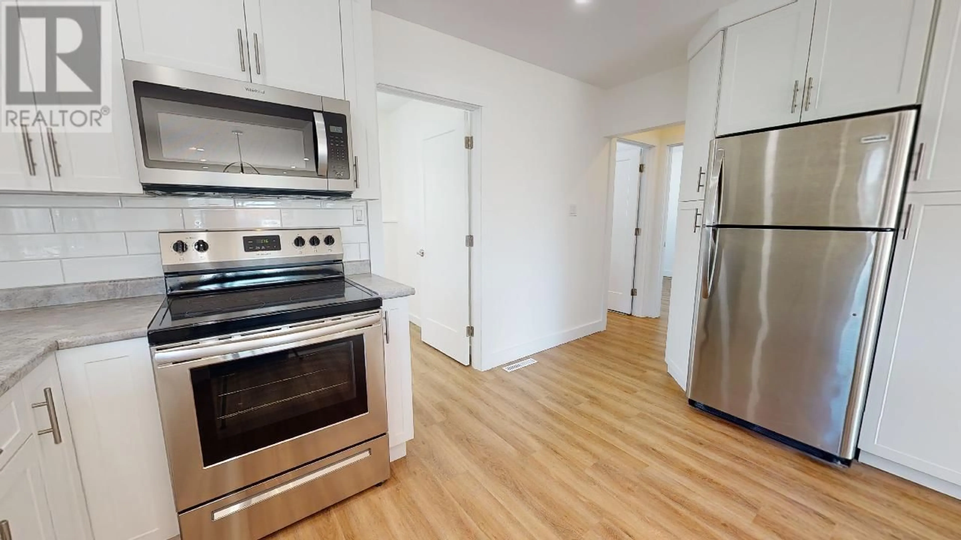 Standard kitchen, wood/laminate floor for 9908 105 AVENUE, Fort St. John British Columbia V1J2M3