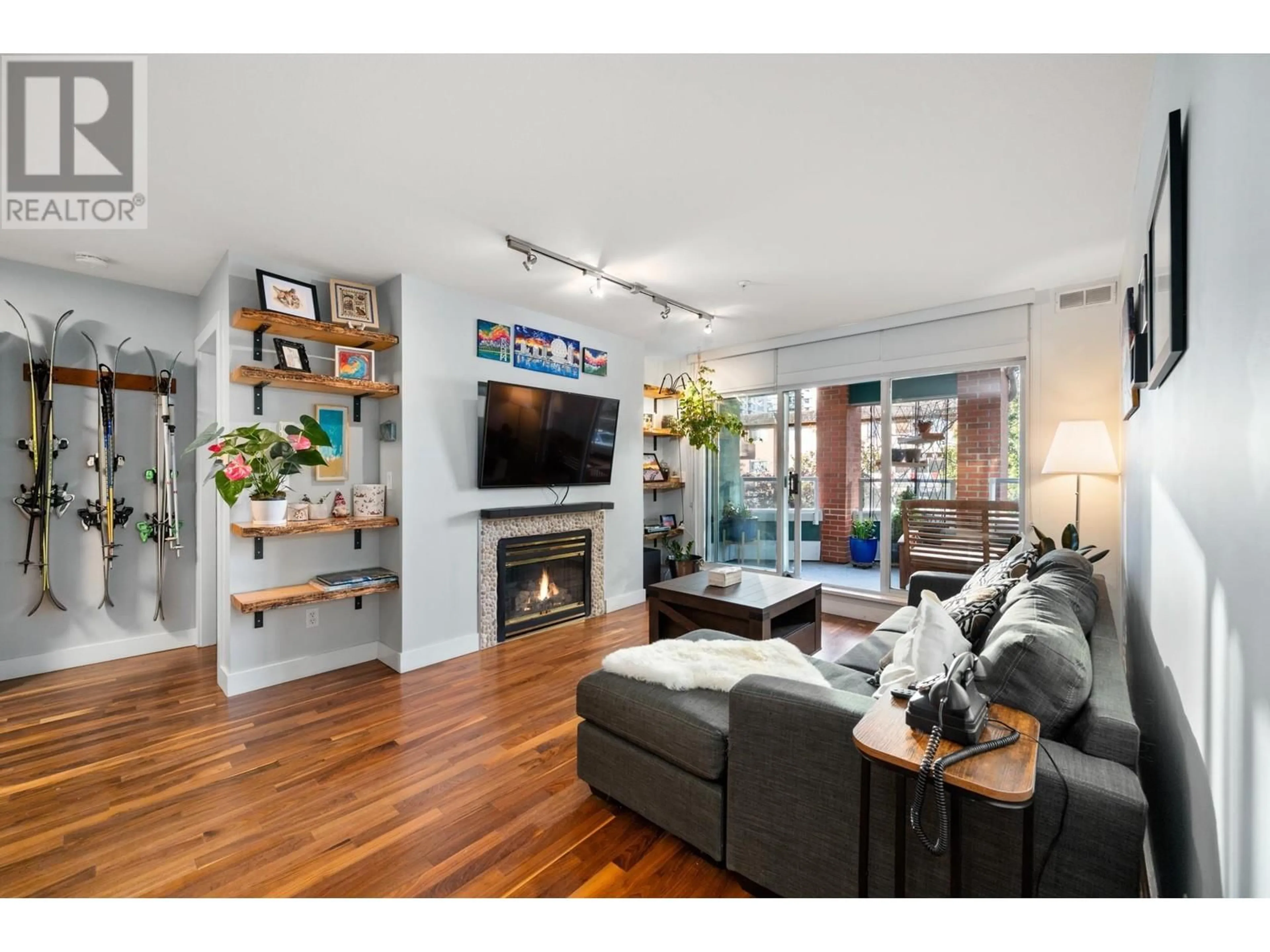 Living room with furniture, wood/laminate floor for 308 128 W 8 STREET, North Vancouver British Columbia V7M3M1