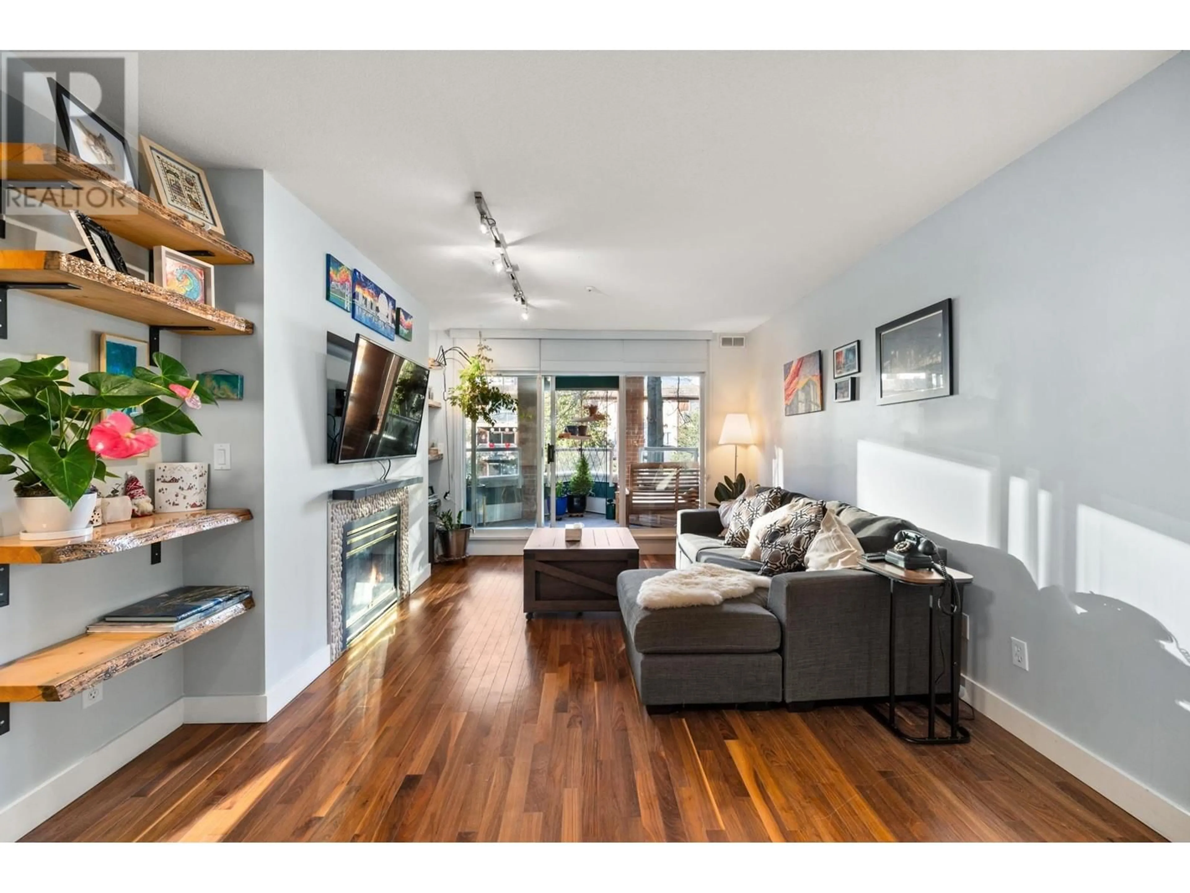 Living room with furniture, wood/laminate floor for 308 128 W 8 STREET, North Vancouver British Columbia V7M3M1