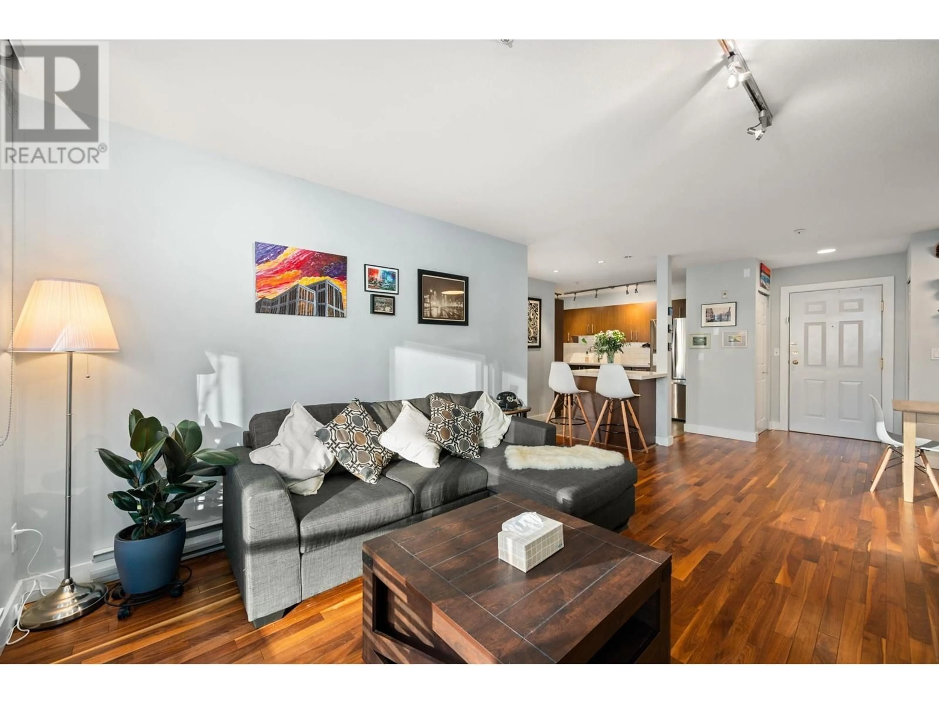 Living room with furniture, wood/laminate floor for 308 128 W 8 STREET, North Vancouver British Columbia V7M3M1