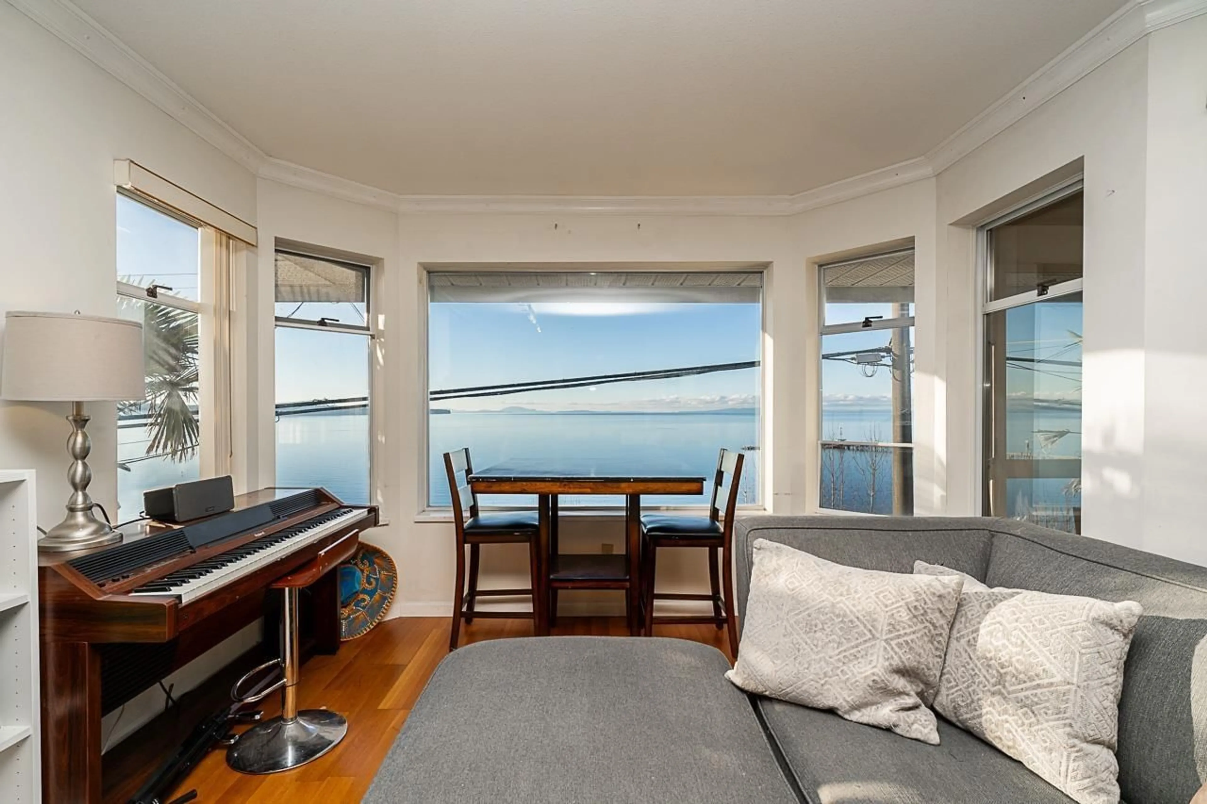 Living room with furniture, wood/laminate floor for 15233 MARINE DRIVE, White Rock British Columbia V4B1C7