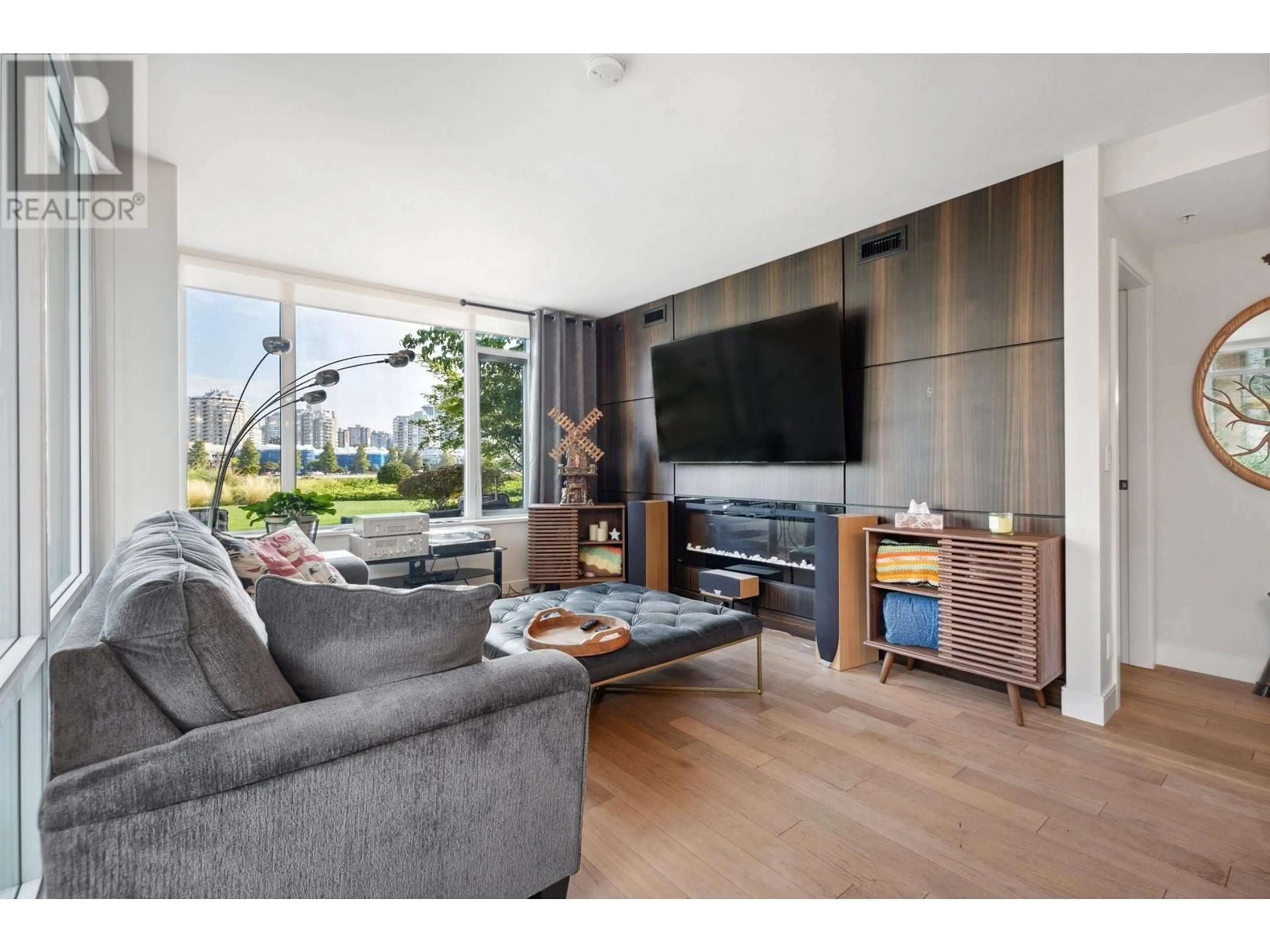 Living room with furniture, wood/laminate floor for 204 210 SALTER STREET, New Westminster British Columbia V3M0J9