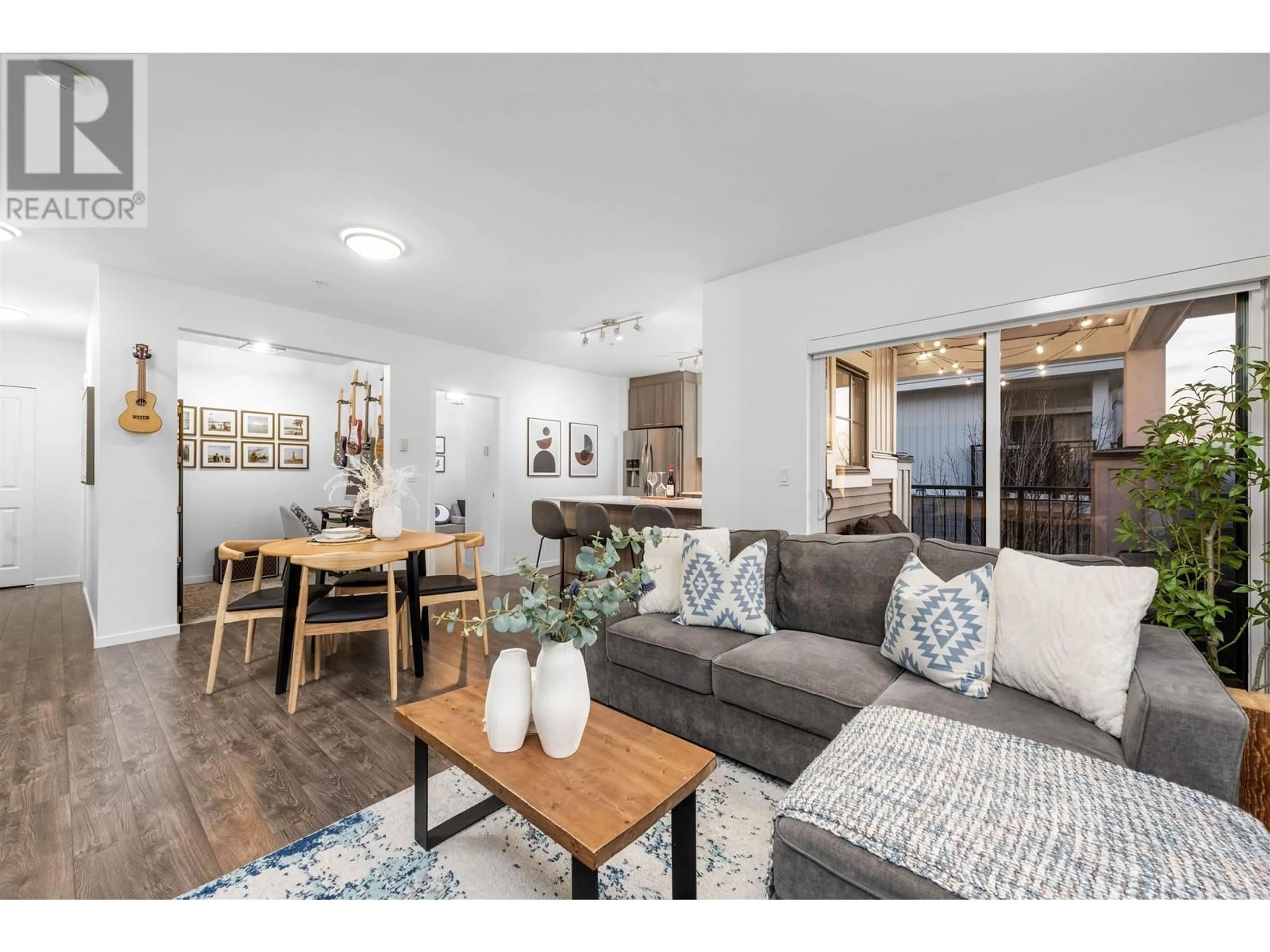 Living room with furniture, wood/laminate floor for 303 210 LEBLEU STREET, Coquitlam British Columbia V3K4L6