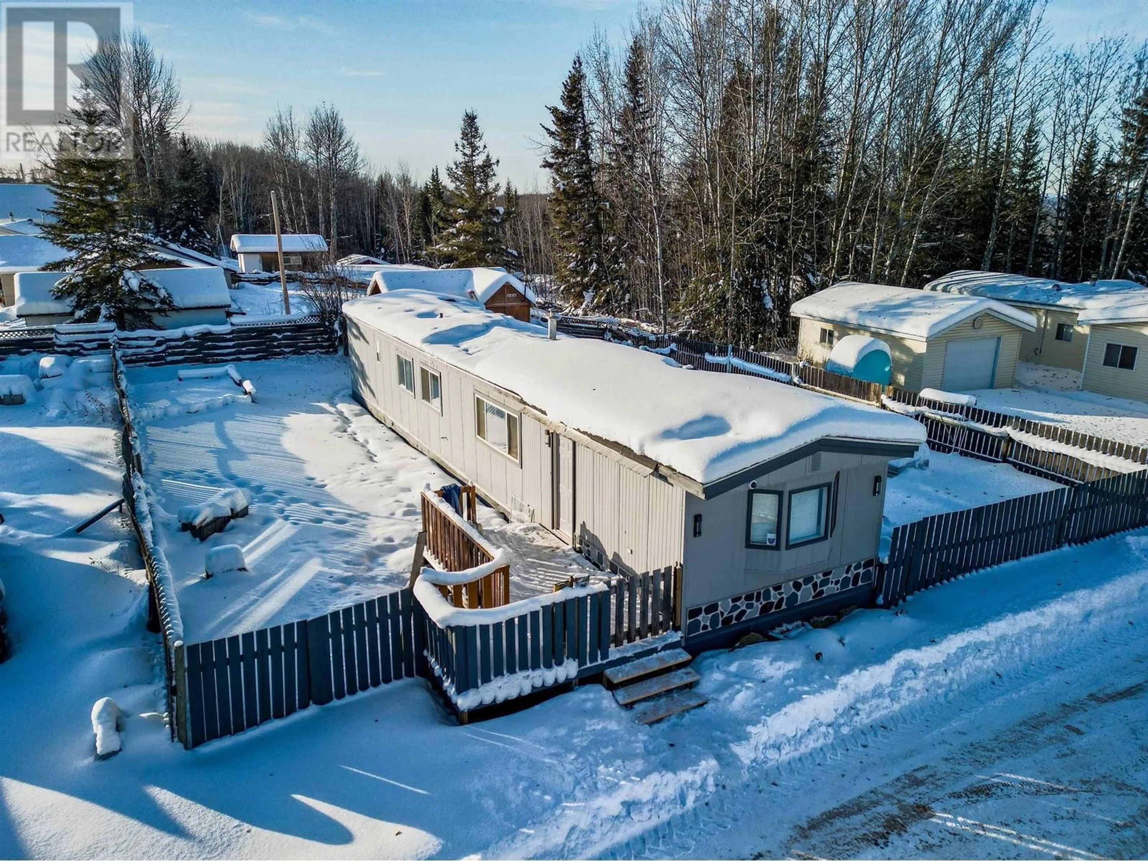 A pic from outside/outdoor area/front of a property/back of a property/a pic from drone, unknown for 1 - 2963 KLAHANNIE DRIVE, Fort Nelson British Columbia V0C1R0