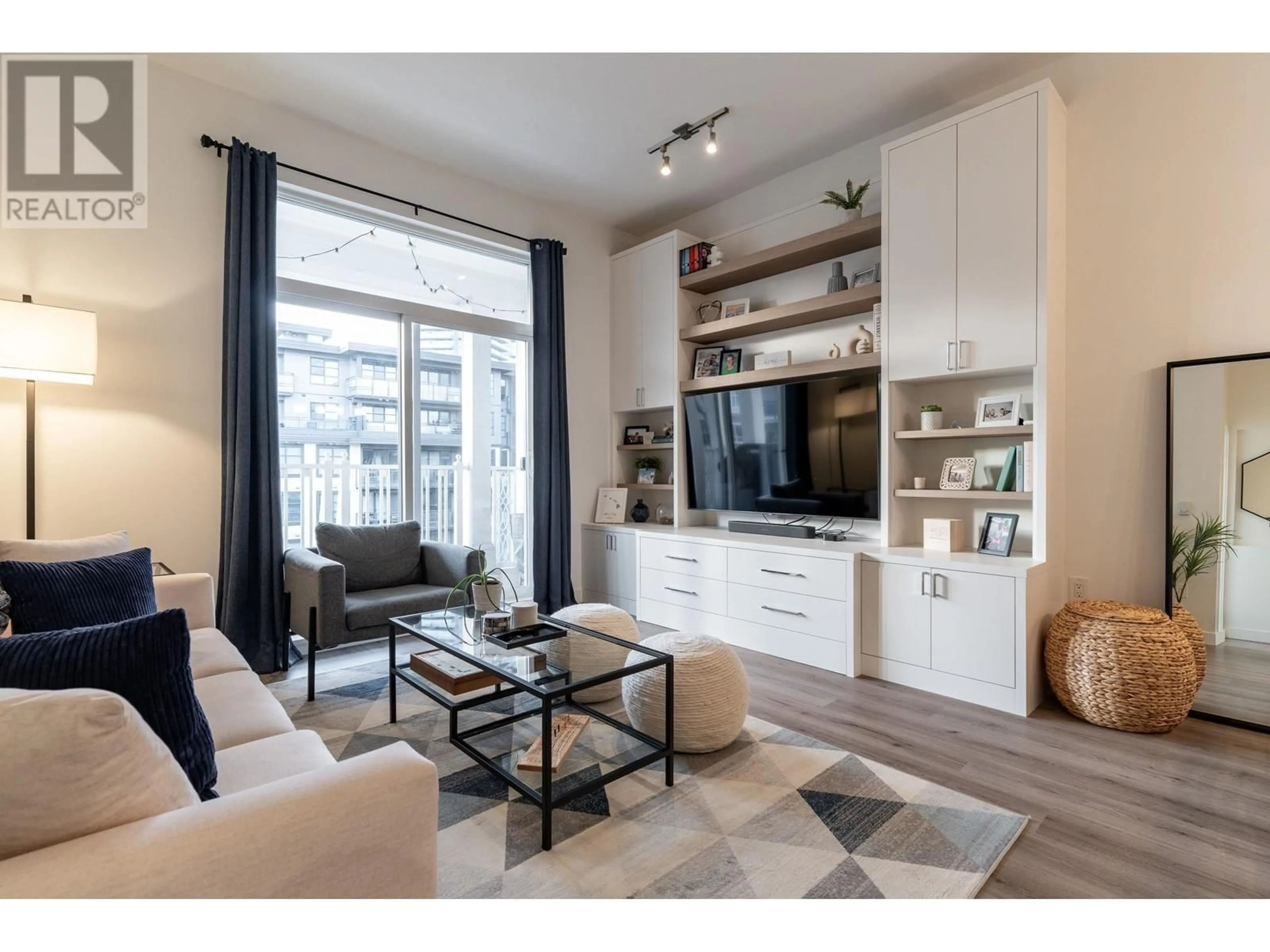 Living room with furniture, wood/laminate floor for 407 608 COMO LAKE AVENUE, Coquitlam British Columbia V3J0B2