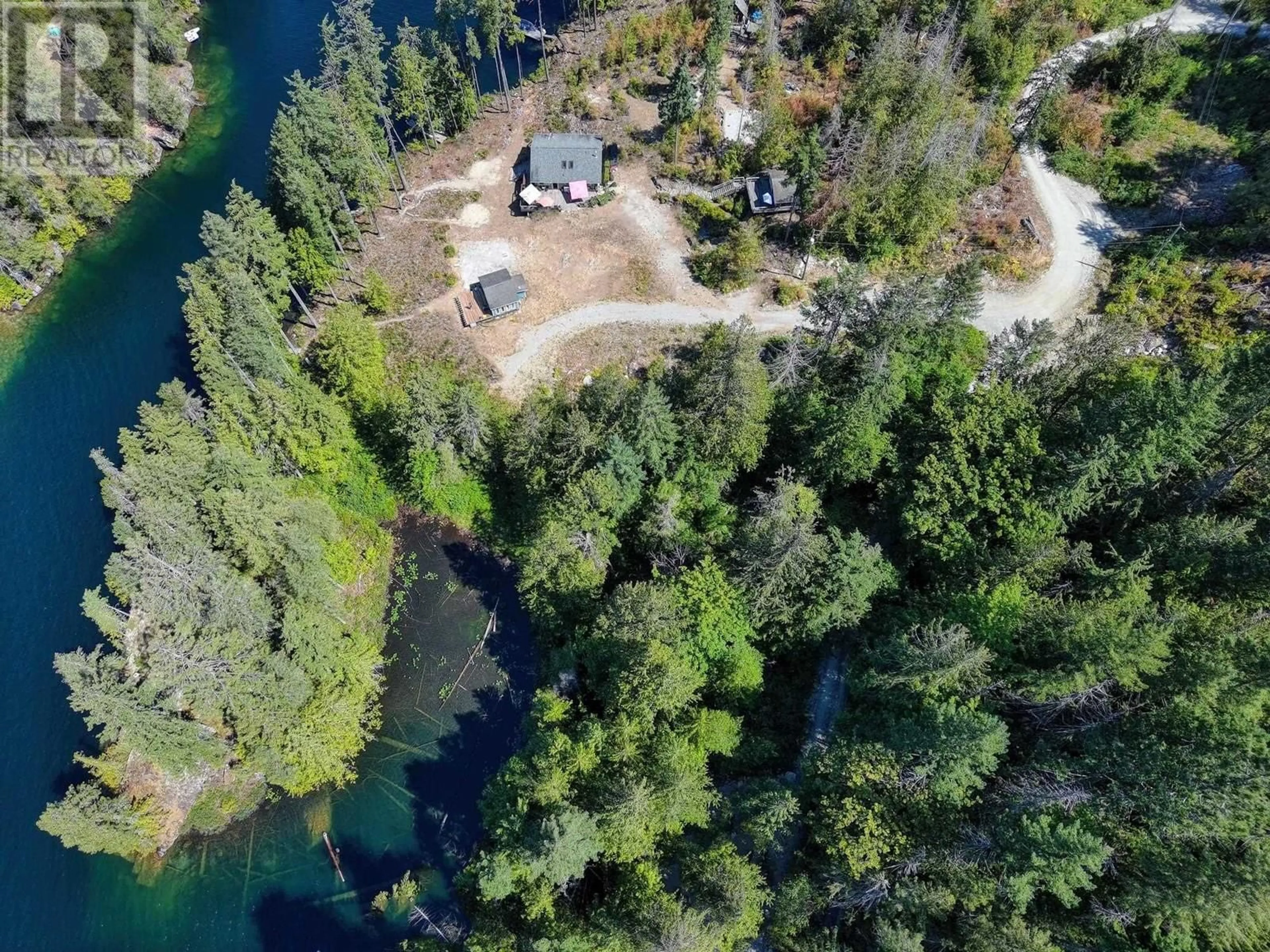 A pic from outside/outdoor area/front of a property/back of a property/a pic from drone, water/lake/river/ocean view for 8625 SAKINAW CREEK ROAD, Pender Harbour British Columbia V0N2H0