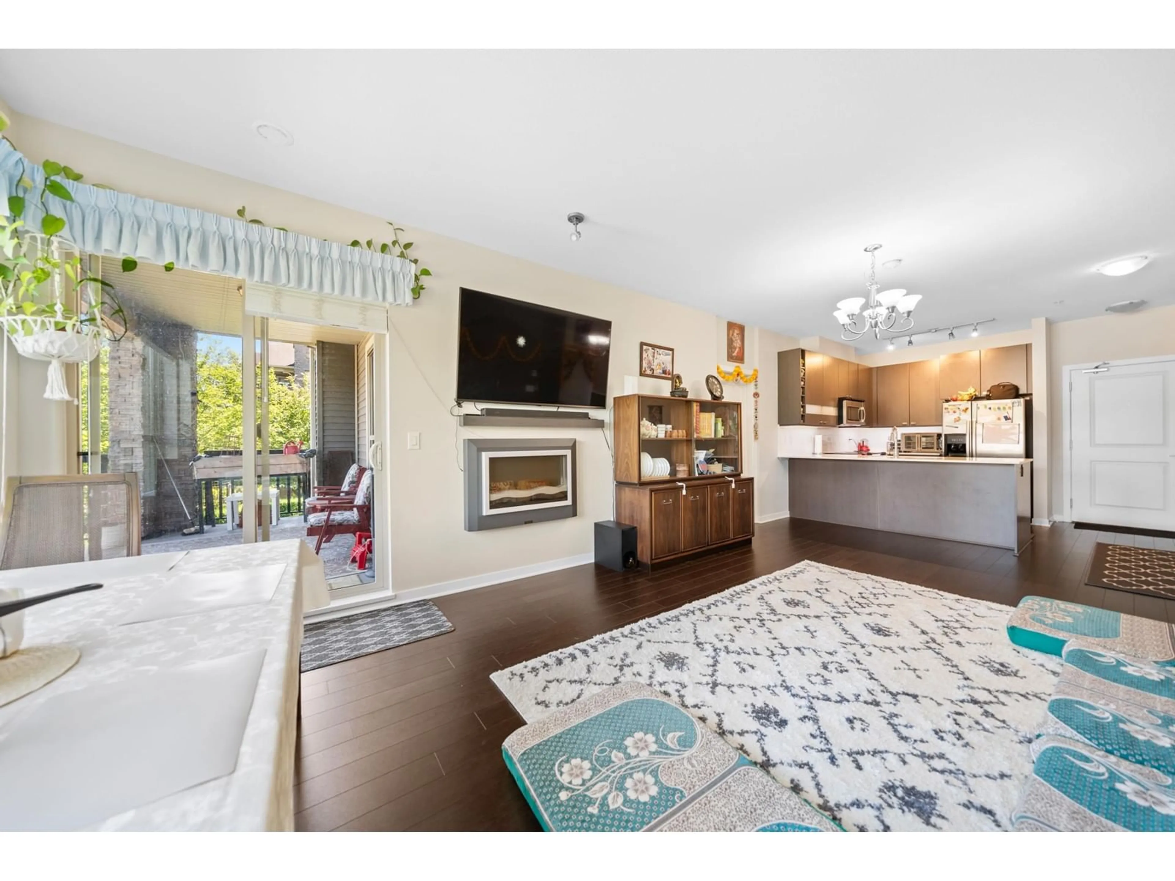 Open concept kitchen, wood/laminate floor for 202 5655 210A STREET, Langley British Columbia V3A0G4