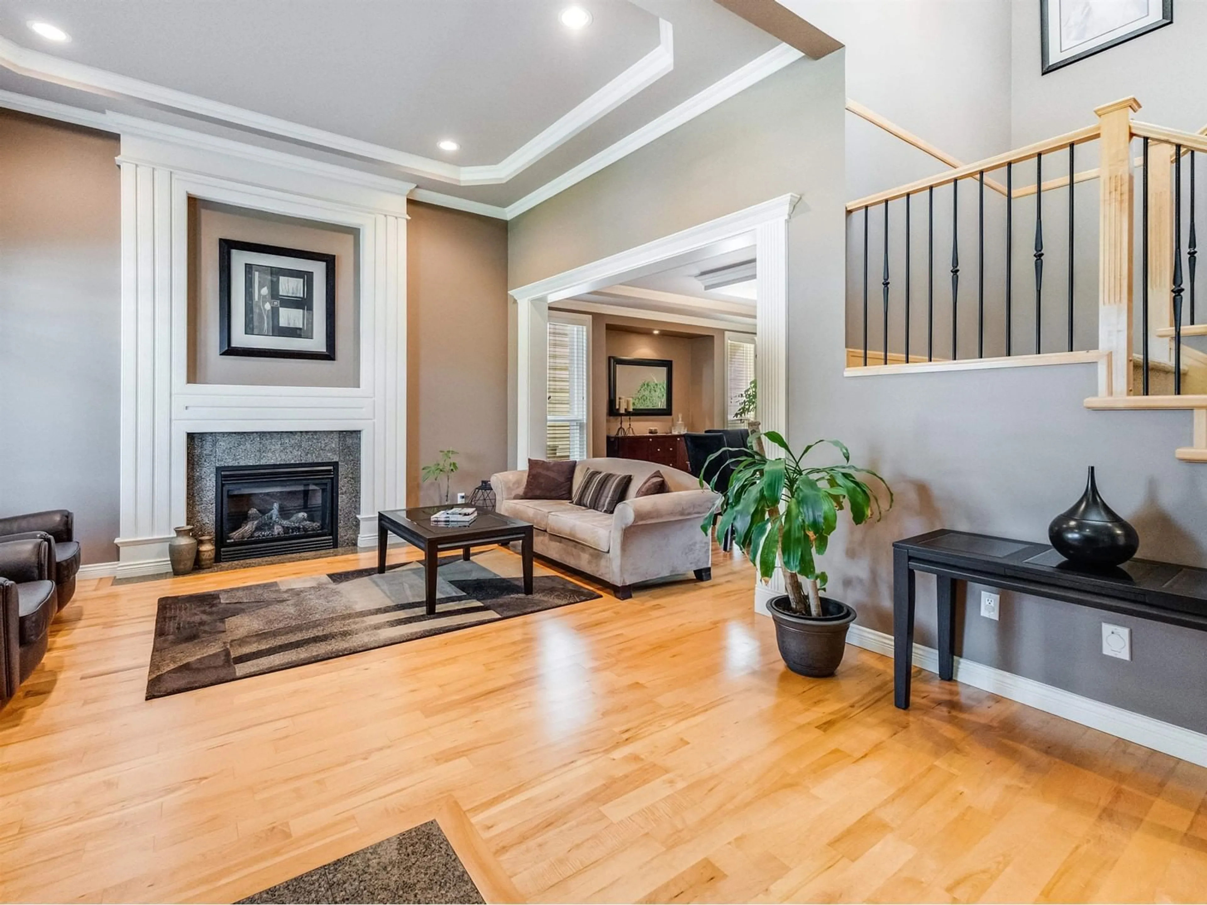 Living room with furniture, wood/laminate floor for 16096 110A AVENUE, Surrey British Columbia V4N4Y1