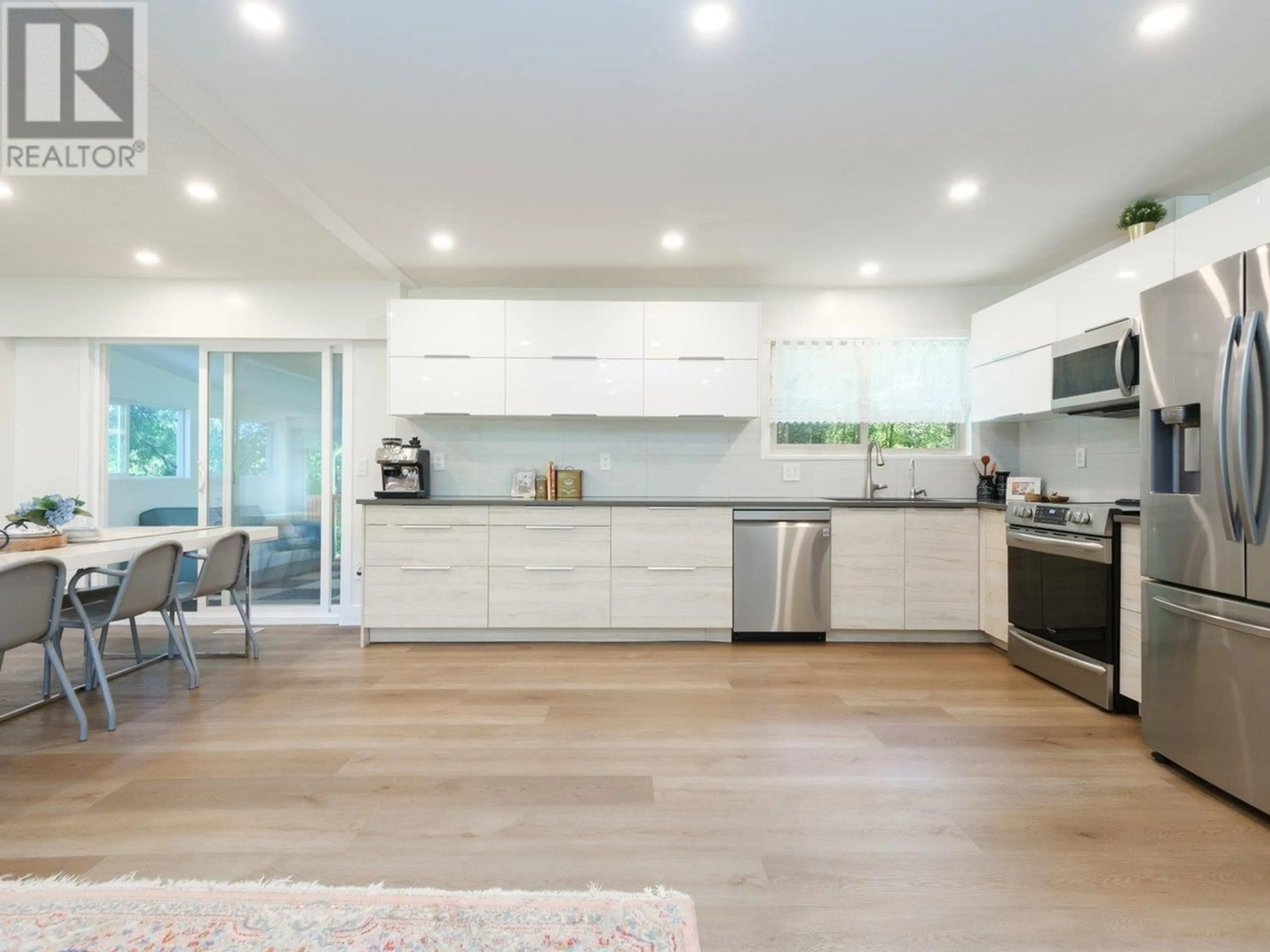 Open concept kitchen, wood/laminate floor for 3796 ST. THOMAS STREET, Port Coquitlam British Columbia V3B2Z5