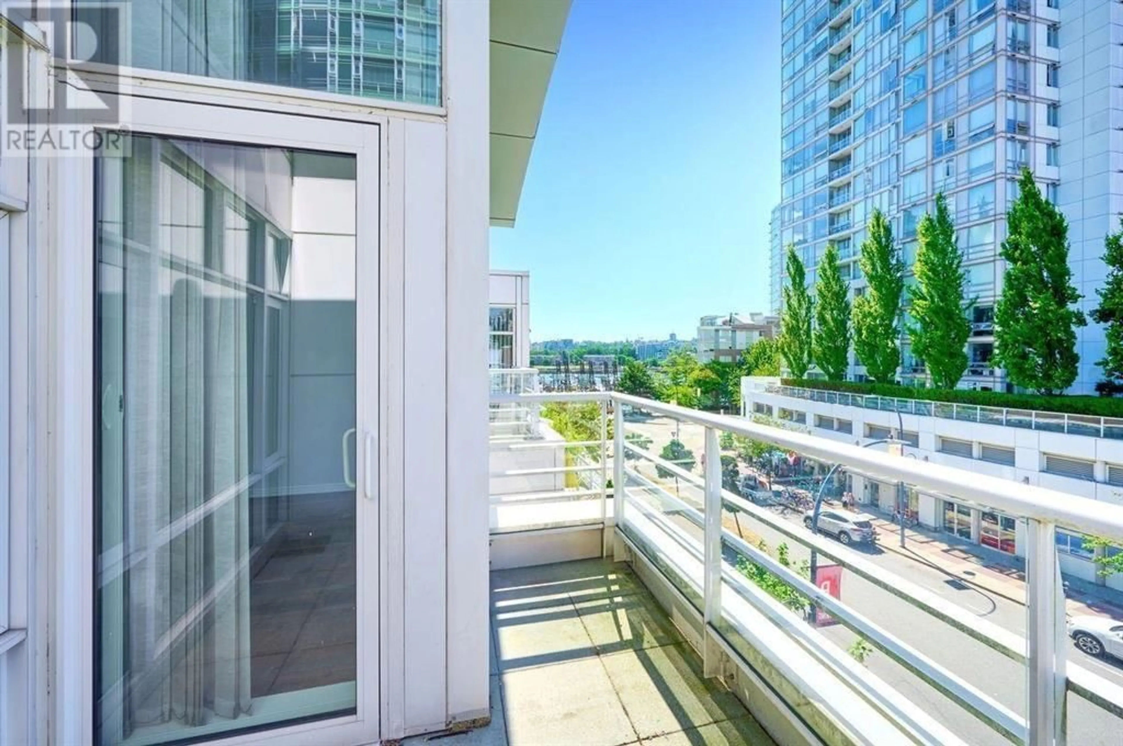 Balcony in the apartment, city buildings view from balcony for TH E 1199 MARINASIDE CRESCENT, Vancouver British Columbia V6Z2Y2